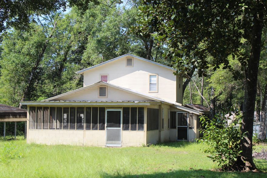 CLASSIC FAMILY FISHCAMP. This home is less than 7 miles from the Choctawhatchee River boat ramp at Cowford and 6 miles from the Black Creek Bridge boat ramp. The home was built with love by four brothers. Many family cook outs have taken place over the years. Lots of fun, fellowship and plenty of fish stories have been told on this property. Designed for family fun and good fellowship this house is well built and in good condition. Big open living/ dining/kitchen area. Screened porch. 2 bedrooms downstairs and 2 bedrooms upstairs. Metal roof. shown by appointment.