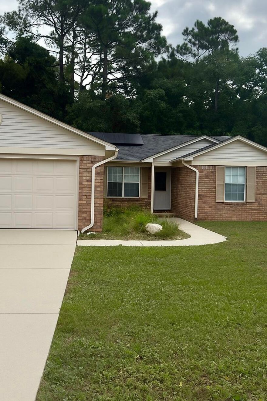 If you're looking for good bones in a great location, this is the house for you! Located in highly desired East Navarre, this well maintained 3 bedroom 2 bath home is a canvas just waiting for your personal style! With an open living concept, the oversized brick fireplace and hearth highlight the great room and make a cozy centerpiece for whatever furniture layout you choose. The open dining space and ample kitchen will make family meals a breeze, and the large front windows and rear sliding door allow light to flow through the room. The spacious bedrooms and master suite provide plenty of space to spread out, and if being outdoors is something you love, you won't want to miss the privacy fenced back yard. Nestled up against an additional parcel of land that is included with the home, the