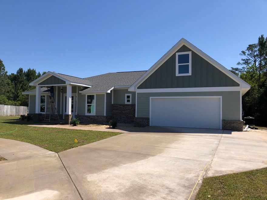 notice how much light comes in from the impact doors and window across the rear of the home & then notice how the home looks and feels so large and open with it's high ceilings and recessed lighting. The kitchen is a chef's dream with beautiful two tone all wood cabinetry. The black leathered granite is a really nice touch and is going to look amazing alongside the stainless appliances soon to be installed. This home features a split floor plan allowing the master bed & bath to be separate from the rest of the home. The large master has high trey ceilings and beautiful custom french doors that leads off to the back yard. The master bathroom is a dream with a gorgeous custom walk in shower, private water closet, double vanity and HUGE 11 X 13 walk-in closet.