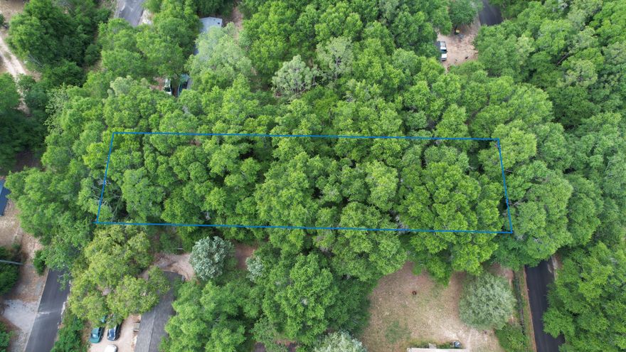 Looking for land that is zoned for mobile homes and is close to town. This level lot is perfect with utilities at the road.  Come make this property your private oasis.