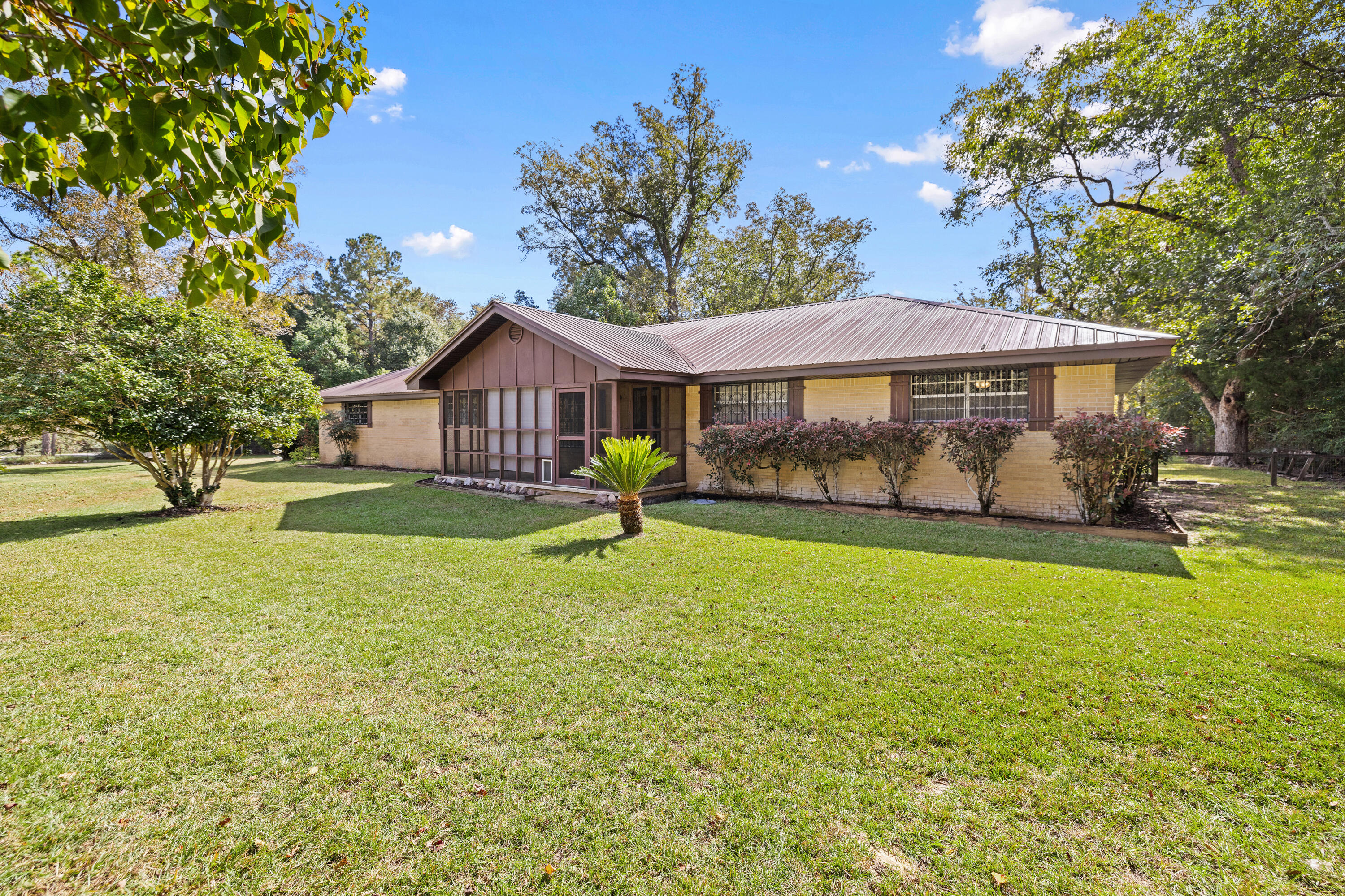 NO HOA- Grab Your 4-Wheeler! This beautiful home is on 3.28 acres in the natural countryside of DeFuniak Springs. This inviting 3-bedroom, 2.5-bathroom residence features a vast floor plan with 2 spacious living areas, and a sunroom. The common areas are filled with natural light, perfect for gatherings.Lounge on the front / back porch and enjoy scenic views of your expansive yard, ideal for gardening or outdoor activities.Enjoy your conveniently located Workshop, Barn and Pole Barn (All powered with electric) just a short distance from the house within your massive yard.A well is located on the property.This property offers the perfect blend of rural serenity and convenience. Don't miss this unique opportunity-schedule a tour today! This is an amazing property!
WATER HEATER 2024 - METAL ROOF 2010-HVAC 2015 - COPPER WIRING
The home is being sold with all decor and furniture included, as seen during the showing.
Please note that some information on county websites may be outdated. The sellers have added additional land to this parcel, bringing the total to 3.28 acres. The updates have not yet reflected on the Walton County websites.
Disclaimer: The listing agent believes that the information provided is accurate and true. However, buyers and/or their agents should verify all pertinent details related to this property, including but not limited to parcel dimensions, acreage, school zone, zoning, land use, and any other information that may influence the buyer's decision to purchase.
