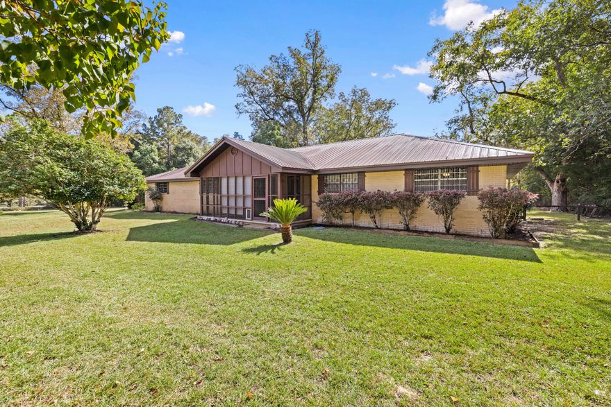 NO HOA- Grab Your 4-Wheeler! This beautiful home is on 3.28 acres in the natural countryside of DeFuniak Springs. This inviting 3-bedroom, 2.5-bathroom residence features a vast floor plan with 2 spacious living areas, and a sunroom. The common areas are filled with natural light, perfect for gatherings.Lounge on the front / back porch and enjoy scenic views of your expansive yard, ideal for gardening or outdoor activities.Enjoy your conveniently located Workshop, Barn and Pole Barn  (All powered with electric) just a short distance from the house within your massive yard.A well is located on the property.This property offers the perfect blend of rural serenity and convenience. Don't miss this unique opportunity-schedule a tour today! This is an amazing property!

WATER HEATER 2024 - METAL ROOF 2010-HVAC 2015 - COPPER WIRING

The home is being sold with all decor and furniture included, as seen during the showing.

Please note that some information on county websites may be outdated. The sellers have added additional land to this parcel, bringing the total to 3.28 acres. The updates have not yet reflected on the Walton County websites.

Disclaimer: The listing agent believes that the information provided is accurate and true. However, buyers and/or their agents should verify all pertinent details related to this property, including but not limited to parcel dimensions, acreage, school zone, zoning, land use, and any other information that may influence the buyer's decision to purchase.