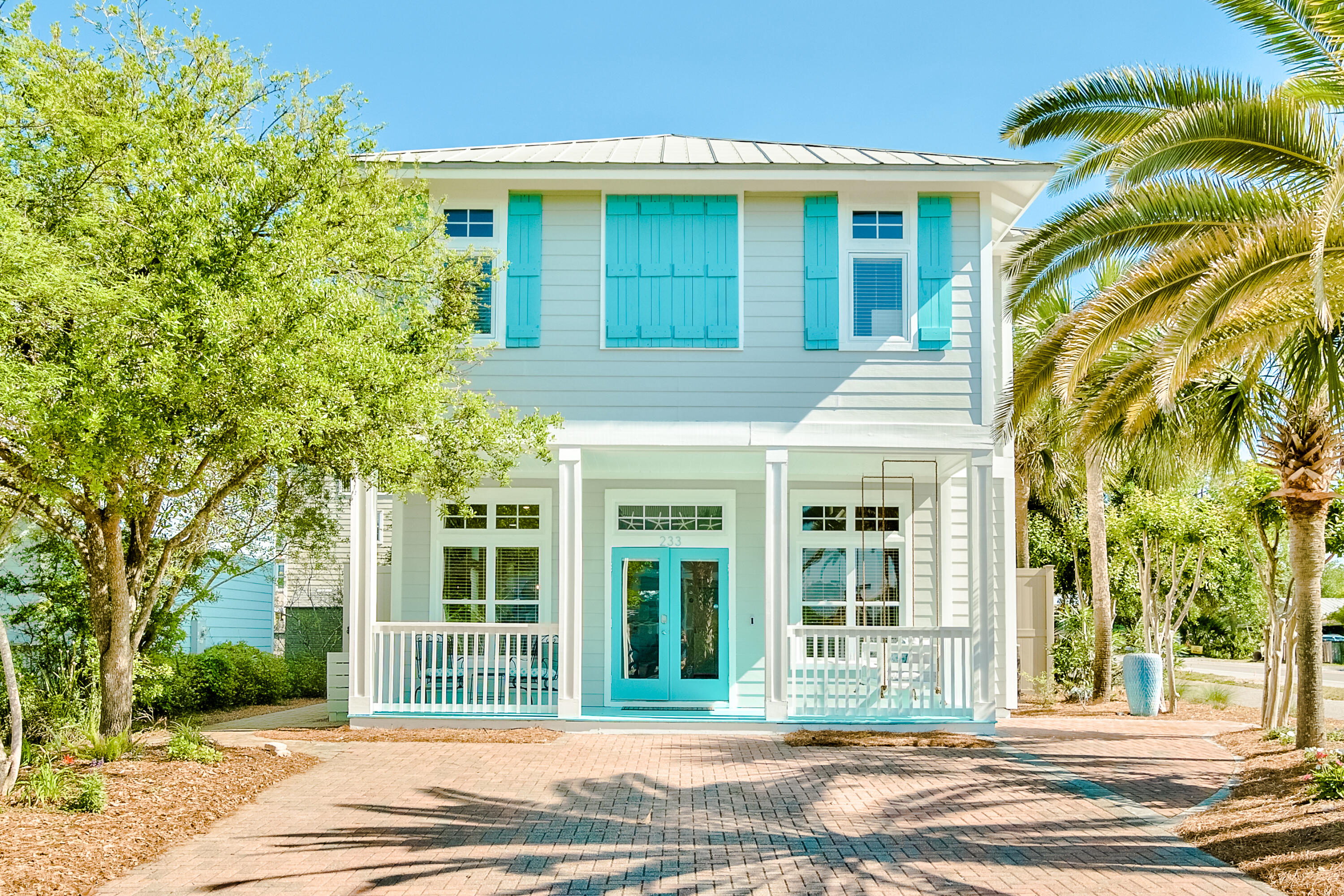 Incredible opportunity to own this exceptional upscale 4-bedroom beach cottage in a prime location in Blue Mountain Beach, famous for its serene beaches, amazing elevations & lively local culture. This property is within walking distance to multiple beach accesses and many dining & entertainment options. The home has many new features including brand new luxury vinyl flooring throughout (2025), Trex front porch, incredible outdoor area complete with paver patio, fire table, bike, kayak & paddle board storage, outdoor shower, bistro lights & 10 ft. privacy fence. You have everything you need to enjoy true coastal living. This home has established rental income bringing in $104k for 2024 and over $80k YTD. With added bunks this home sleeps 12 & is being sold turn key with GOLF CART INCLUDED You will in love immediately with the charming beach vibes from the teal shutters and door paired with tropical landscaping. The home features a metal roof and hardiboard exterior and quintessential welcoming front porch with new swing. The open floor plan is ideal and there is plenty of room to relax in the living area. Tile floor extends throughout the main level and there is nice natural light throughout. Access the back patio just past the kitchen if you want to enjoy dining outdoors under the stars along with the ambiance of the fire table and bistro lights. The granite breakfast bar is perfect for casual dining and the blue shiplap is a nice craftsman touch. Kitchen features updated lighting, stainless steel appliances and new modern subway tile backsplash was recently updated for a clean look. The downstairs bedroom is a nice convenience and offers a queen bed and new flooring plus direct access to a full bathroom. There is a dining area and mini fridge behind the living area and the upper level features the additional 3 bedrooms. The stairs were just updated to LVP with wood treads which is a vast improvement to the prior carpet. Three large windows (recently replaced) on the stairwell bring in great natural light and the landing area is a great conversation spot. The generously sized primary bedroom has brand new floors, a king bed, working station and newly added bunk room, making this area ideal for families. The elegant ensuite primary bathroom has updated Quartz double vanity and upscale walk-in shower with unique tile accent, rain shower head and glass surround. This floor also encompasses a guest room with two twin beds, smart TV and video games, an additional guest room with king bed, smart TV and direct access to the guest bathroom. Beautifully decorated with a subtle beach style decor, located in the highly prized vacation destination of 30A, and offering enough sleeping accommodations for larger groups...this home has generated nice rental income. The newly added & enclosed bunk room off the primary brings the square footage up to 1,924.
This home is nicely situated in a quiet neighborhood yet still right in the heart of the iconic 30A area of Blue Mountain Beach. Enjoy your time boating or fishing at Western Lake at Grayton Beach, hiking or biking the nature trails, or soaking up the warm Florida sun on the pristine beaches of the Gulf of Mexico. All of it just minutes away! There is a an easement to a beach just down the road and you have access to public beaches too at Highway 83 Blue Mountain access or Gulfview Heights access. You may even be able to join the amenity package at Village of Blue Mountain Beach (if available) for access to a pool, fitness center and shuffle board right across the way.
Blue Mountain Beach is also the highest elevation of Florida's Gulf Coast lending incredible views and beautiful natural dunes and wild flowers. Enjoy the great outdoors with the surrounding state parks, nature trials and the 22-mile bike & jogging path. Kayak or paddle board on one of the rare coastal dune lakes and experience a unique ecosystem that is only available to approximately 5 locations in the world! There are many options nearby for dining and entertainment and you are also close to Grayton Beach and Gulf Place. Do not miss out on this incredible opportunity to own a charming, one level home in Blue Mountain Beach. This is an ideal primary or second home to enjoy the coastal lifestyle or a prime rental investment if desired, with established rental income breaking $100k annually!