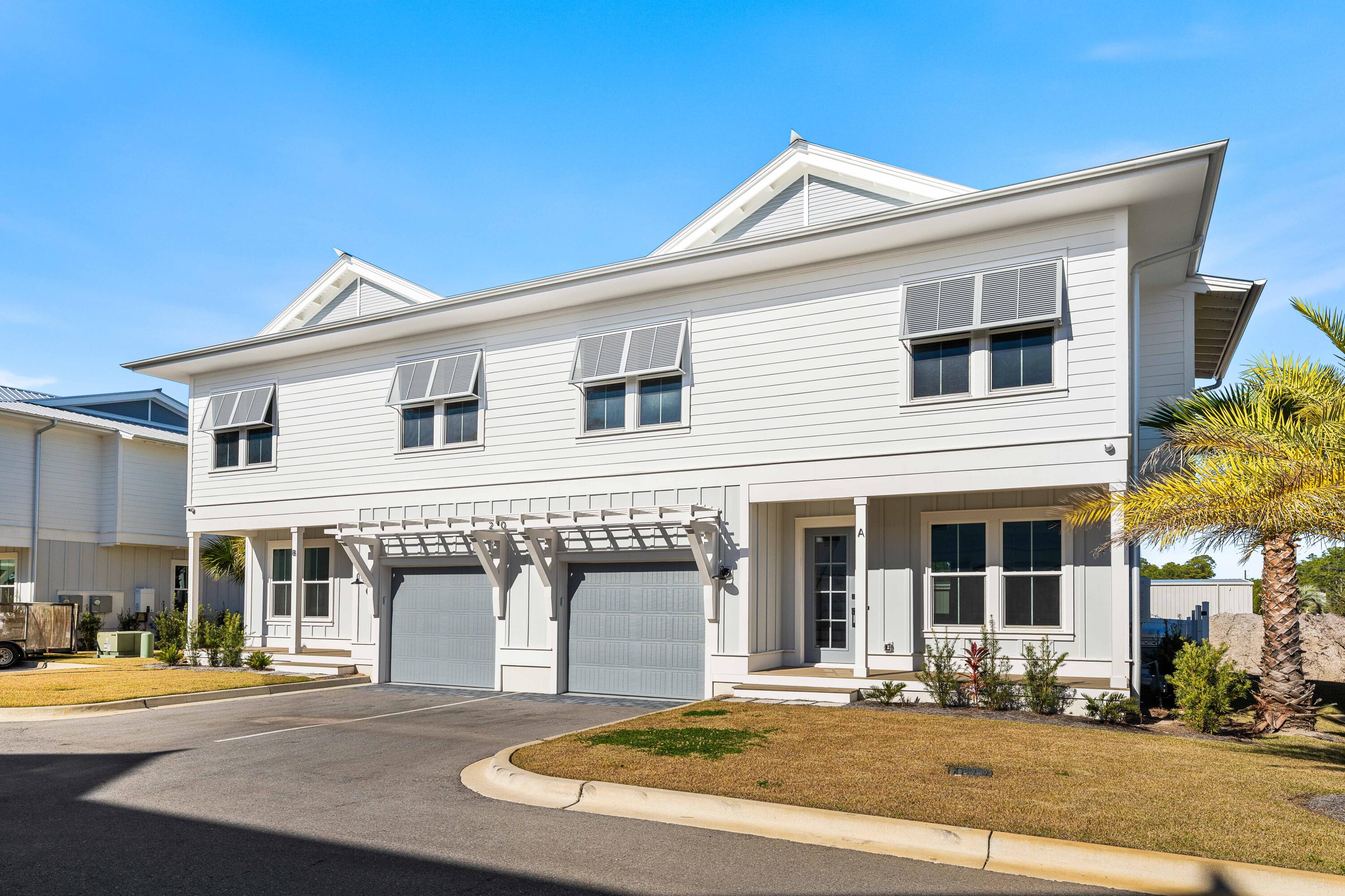 Welcome to Century 393, the newest and most exciting townhome development in Santa Rosa Beach, Florida. Perfectly positioned at 520 S Co Hwy 393, this exclusive community offers unparalleled access to 30A's best just a three-minute golf cart ride to Ed Walline Beach, Shunk Gulley, Papa Surf Burger Bar, and the lively Gulf Place town center. Unit #20A boasts 1,914 square feet of heated and cooled living space, with 2,412 square feet under roof. Designed for modern coastal living, this three-bedroom, four-and-a-half-bath townhome features a versatile bunk room, high-end finishes, an outdoor kitchen, and a fully fenced backyard making it an ideal personal retreat.The open-concept first floor seamlessly connects the living, dining, and kitchen areas, with ample natural light enhancing the coastal elegance. A walk-in pantry, laundry room, powder bath, and one-car garage complete the main level.
Upstairs, the spacious primary suite boasts a dual vanity and walk-in shower, while both guest bedrooms each feature their own private ensuite baths. The additional bunk room offers flexibility as an office or extra sleeping area, complemented by a hall bath with a double vanity and tub/shower combo. Every home in this exclusive community enjoys an outdoor kitchen and a fenced backyard for private entertaining. A dedicated ice machine in the garage makes beach days effortless. This marks the first completed phase, with future expansion on an adjacent 10 acres set to introduce a stunning community pool, sun deck, and cabana. Don't miss your chance to rent in this premier up and coming development along 30A.