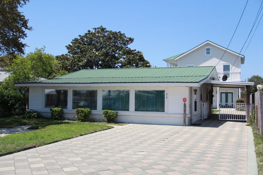 A unique find in Kiska Beach, 2 homes on one lot. Sq ft total is for both homes. Single story home was totally renovated in 1982 and then updated in 2002. Two bedroom, 3/4 bath and an enclosed laundry room off the bathroom. Large sunroom in the front that could easily have a closet to make the one story a 3 bedroom. Tiled throughout the home except laundry room. Granite countertops in the kitchen and bathroom. Shower is travertine tile surround. A new a/c unit was installed in May 2018. Home is built with cinder blocks and a metal roof was replaced in 2002. Outside has a fresh coat of elastomeric paint.