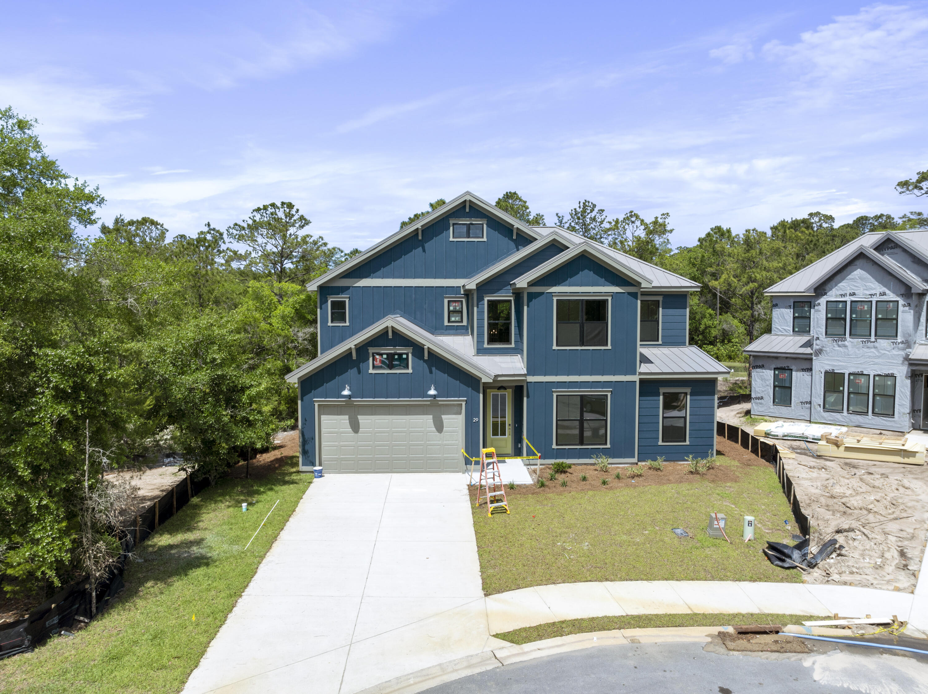 Welcome to The Shoal, a brand-new neighborhood where tranquility meets convenience. Nestled on the fringes of the expansive Point Washington State Park, this community boasts 30 thoughtfully designed homesites, each strategically laid out to provide residents with a sense of privacy and a connection to nature. The Shoal is conveniently located a short drive to Seaside, Grayton Beach and 30a. These spacious homes are designed to harmonize with the unique esthetics of the area boasting earthy tones, a community pond, and half of the lots backing up to state park. The Trenton floor plan offers 5 bedrooms and 4.5 baths with an open living concept downstairs and a spacious loft area upstairs. . *** These are pictures of the same model but not the exact house for lot 28.*** Welcome to The Shoal, a brand-new neighborhood where tranquility meets convenience. Nestled on the fringes of the expansive Point Washington State Park, this community boasts 30 thoughtfully designed homesites, each strategically laid out to provide residents with a sense of privacy and a connection to nature. The Shoal is conveniently located a short drive to Seaside, Grayton Beach and 30a. These spacious homes are designed to harmonize with the unique esthetics of the area boasting earthy tones, a community pond, and half of the lots backing up to state park. The Trenton floor plan offers 5 bedrooms and 4.5 baths with an open living concept downstairs and a spacious loft area upstairs.
This home comes with amazing standard features such as a metal roof, impact windows/doors, quartz countertops, LVP floors throughout all of the common areas/bedrooms, 8 ft doors, and a gas range and vented hood in the kitchen just to name a few! Homeowners have the ability to choose their finishes and upgrades at their design appointment. Other notable upgrade options would be a free-standing tub in the master bath and a sunroom option downstairs. **Prices may vary based on upgrades and lot selection.** Photos are not of this exact home. Renderings show potential exterior paint color options**