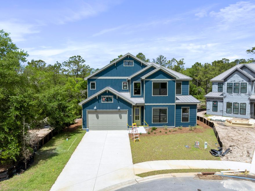 Welcome to The Shoal, a brand-new neighborhood where tranquility meets convenience. Nestled on the fringes of the expansive Point Washington State Park, this community boasts 30 thoughtfully designed homesites, each strategically laid out to provide residents with a sense of privacy and a connection to nature. The Shoal is conveniently located a short drive to Seaside, Grayton Beach and 30a. These spacious homes are designed to harmonize with the unique esthetics of the area boasting earthy tones, a community pond, and half of the lots backing up to state park. The Trenton floor plan offers 5 bedrooms and 4.5 baths with an open living concept downstairs and a spacious loft area upstairs. . *** These are pictures of the same model but not the exact house for lot 28.*** Welcome to The Shoal, a brand-new neighborhood where tranquility meets convenience. Nestled on the fringes of the expansive Point Washington State Park, this community boasts 30 thoughtfully designed homesites, each strategically laid out to provide residents with a sense of privacy and a connection to nature. The Shoal is conveniently located a short drive to Seaside, Grayton Beach and 30a. These spacious homes are designed to harmonize with the unique esthetics of the area boasting earthy tones, a community pond, and half of the lots backing up to state park. The Trenton floor plan offers 5 bedrooms and 4.5 baths with an open living concept downstairs and a spacious loft area upstairs.

This home comes with amazing standard features such as a metal roof, impact windows/doors, quartz countertops, LVP floors throughout all of the common areas/bedrooms, 8 ft doors, and a gas range and vented hood in the kitchen just to name a few! Homeowners have the ability to choose their finishes and upgrades at their design appointment. Other notable upgrade options would be a free-standing tub in the master bath and a sunroom option downstairs. **Prices may vary based on upgrades and lot selection.** Photos are not of this exact home. Renderings show potential exterior paint color options**