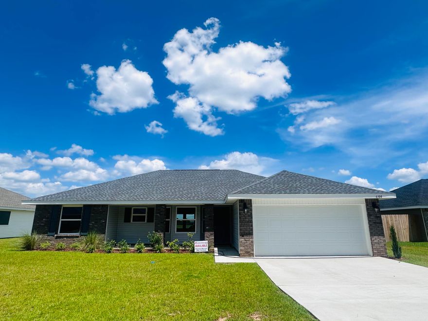 THis 1605 sq ft home will feel much bigger as you enter. Both dining and living rooms have cathedral ceilings. The kitchen overlooks the living room and has alot of counter space! You'll see alot of natural light coming in as the living room has 3 windows as well as a door out to the large covered porch, a window in the kitchen and a bay window in the dining area. This is a split bedroom plan. The master bath has both a garden tub with window and a separate walk in shower. All wet area floors are adorned with an upgraded flooring called Puretec. All other rooms have carpet. The exterior is front sided brick with 3 sided maintenace free vinyl. This home comes with a 10 yr Bonded Builders warranty.