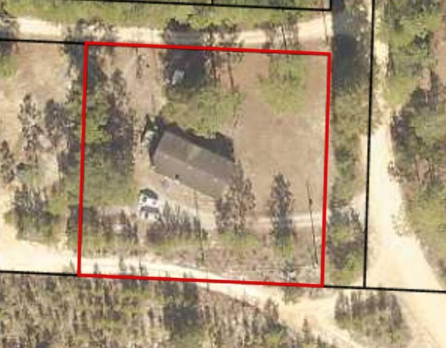 Nice 1/2 acres corner lot with deep well, electric and septic tank.  Mobile home conveys at no value it needs major TLC. No Restrictions or HOA! Located in Flood Zone X, which requires no flood insurance or extra building requirements. Plenty of space for all your fun recreational toys!