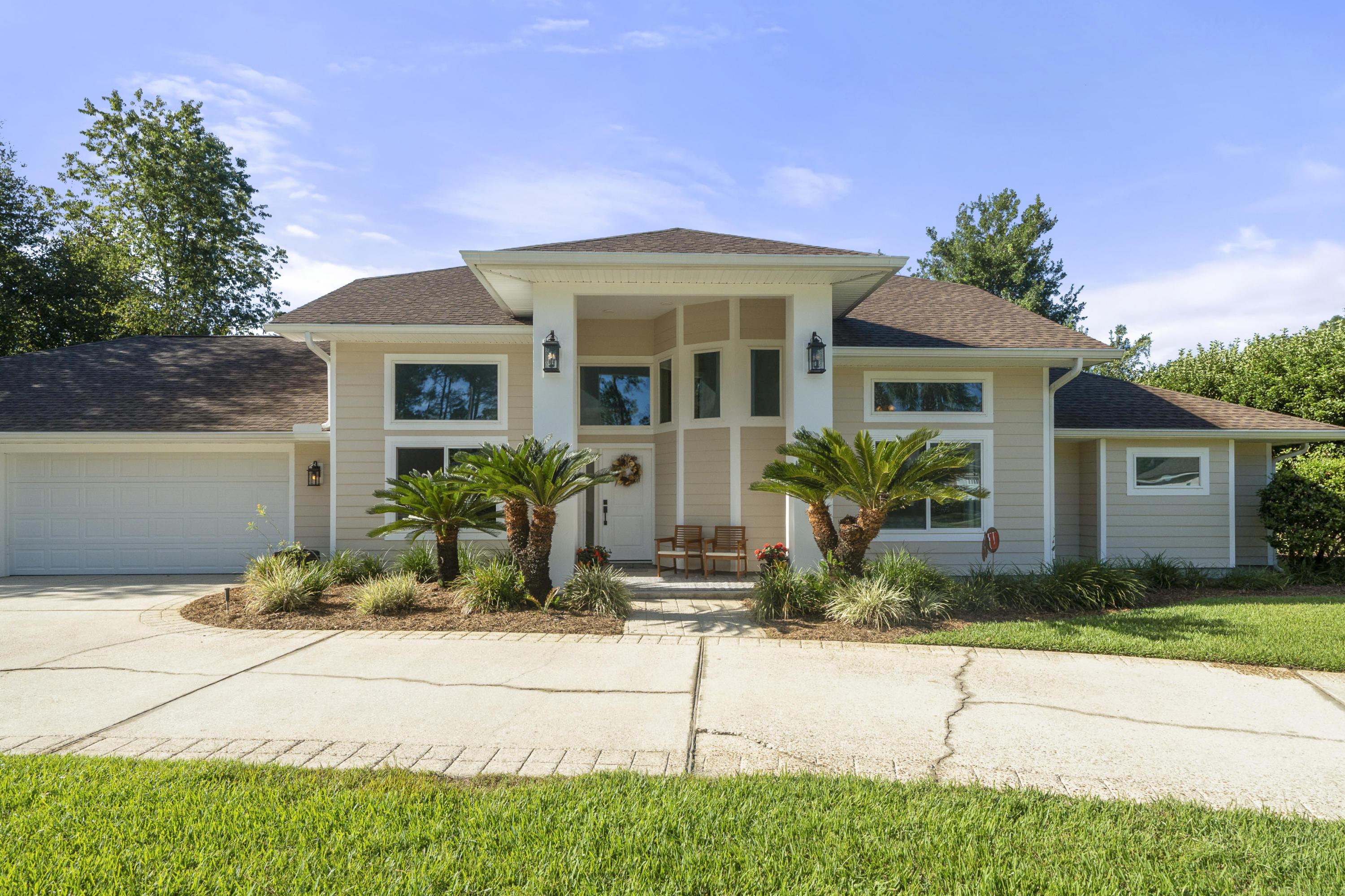 Exquisite pool home in Magnolia Plantation! This home has had a complete exterior renovation to include impact windows and doors, brand new fiber cement board siding. The large screened in pool and patio area creates an oasis with the newly renovated pool and hot tub with modern tile and center fountain, you'll want to spend all your time there. The interior boast a chef's kitchen with a center island updated appliances and lots of natural light. The incredibly large master bedroom has it's own seating area for peace on quiet and has private access to the screened pool. Updated master bath features a separate tiled shower and a large tub for soaking. Upstairs there's two bedrooms each with their own private bath and a balcony. This home will not disappoint, A+ school district and just