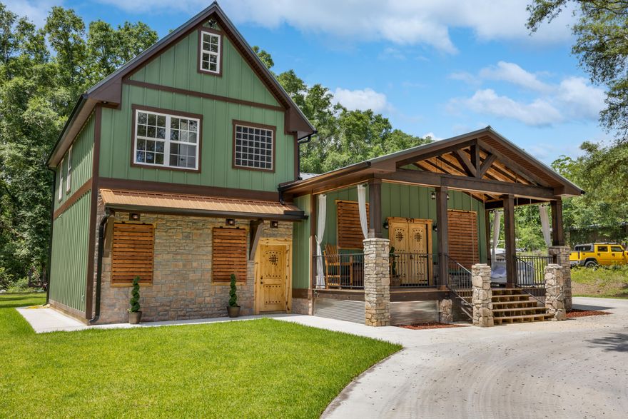 Owner Financing available with 25% Down; 5% interest Rate, amoritized over 30 years with a three year balloon.  Gorgeous, custom built 5 bed/3 bath home completed in 2022.  Walk up to the large, covered front porch with rock pillars and wood beams above to enter the home through the beautiful, custom made wood double front doors.  Once inside, you will be in the kitchen/dining area with stainless appliances, center island and granite  countertops.  Main Level Master Suite has a wood barn door into the Master Bath, with double sinks, a step up jacuzzi tub, separate tiled shower and a walk in closet.  Before you head upstairs, step down into the large living room complete with an electric fireplace with a built in heater that heats up to 900 sq ft. with multiple color settings and