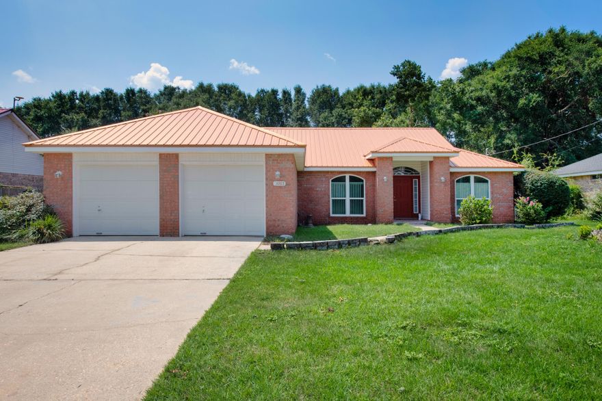 This move-in-ready gem, nestled near the South end of Crestview, offers easy access to HWY 85, so you can zip around to shopping, local dining, and all your favorite spots. Plus, you're just a short commute away from Eglin AFB, Duke Field, and Hurlburt AFB. Step inside and be wowed by the gleaming wood floors that lead you straight to the Great Room, where a cozy wood-burning fireplace awaits. The open kitchen is a dream with its stylish tiled back-splash and countertops, matching the bathroom tiles for a cohesive look. Out back, you'll find a screened-in stone patio that opens up to a sprawling backyard, complete with a stunning 12 ft octagon gazebo that's perfect for outdoor fun or peaceful relaxation. This home is in tip-top shape, but ready for your personal touch.