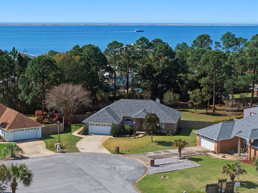 Welcome to your private coastal retreat in the desirable Sound Retreat neighborhood--perfectly tucked away on a quiet cul-de-sac on the charming street of Nautilus Drive. If you love the Emerald Coast lifestyle, this location alone will capture your heart.More DRONE photos coming soon! Residents of Sound Retreat enjoy water access for boating, kayaking, fishing, and soaking in the refreshing coastal breeze, making it easy to experience the very best of Florida living just moments from your front door. Walking your dog and riding bikes. This is a truly beautiful Sound side neighborhood of Navarre. This beautiful brick pool home is in remarkable condition and offers both comfort and peace of mind. The roof was replaced just two years ago, an important upgrade that many buyers appreciate when securing homeowner's insurance.

Step outside and you'll discover your own backyard oasis. The home features a screened-in pool enclosure, allowing you to enjoy swimming and relaxing year-round while keeping the space protected. The fully fenced backyard sits on an impressive .56-acre homesite, providing privacy, room to spread out, and mature landscaping that surrounds the property with natural beauty. With no neighbors directly behind you, the setting feels peaceful and secluded.

Inside, the home offers four full bedrooms and two bathrooms, giving you flexibility for extended family, guests, or dedicated office space. The layout spans just under 2,200 square feet and reflects a classic traditional design that feels both spacious and welcoming.

A long, deep driveway provides plenty of parking in addition to the two-car garage--perfect for visitors, extra vehicles, or recreational toys for the water.

The sellers are offering a flexible closing date to accommodate buyers' needs.

Showings require 2-3 hours notice. Be sure to watch for upcoming open house dates and times online--this is a home you'll want to experience in person.

Come discover why life in Sound Retreat on Nautilus Drive is such a special place to call home.
Water Heater is 13 years old. Could need replacement depending on insurance companies requirements. HVAC is 18 years old and maintained. Owners are willing to provide a home warranty at closing. 