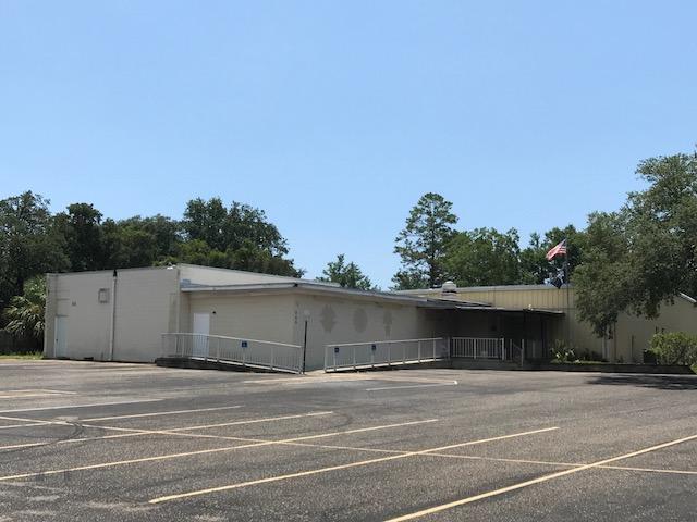 An incredible location close to Shopping, Churches, Restaurants, Chain stores and residential neighborhoods. This mixed use property provides an almost unlimited potential. Use it as is and create a venue that is great for parties and events. A commercial kitchen, separate bar areas, office spaces, storage space and separate women's and men's bathrooms are included in the 7400 square foot building. Ample parking for large events. Use the property itself to construct multi-family apartments or townhomes. Use the floor space for a small manufacturing concern.