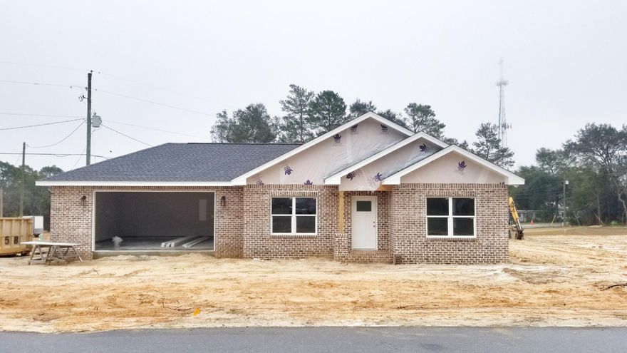A MUST SEE!! Brand new, beautiful all brick home in the heart of Niceville. Located within walking distance to schools, including NWFSC. This house features high impact windows up to 150 mph, heavy duty 30-year shingle roof and an oversize garage with insulated door. LED lightning throughout the house. All the floors in living areas and bedrooms are waterproof wood laminate, and tile in the wet areas. The kitchen is loaded with stainless steel, energy efficient appliances, a large 33 inch kitchen sink and tile back splash. White maple, soft-close cabinets and granite counter-tops in kitchen, all baths and laundry room.