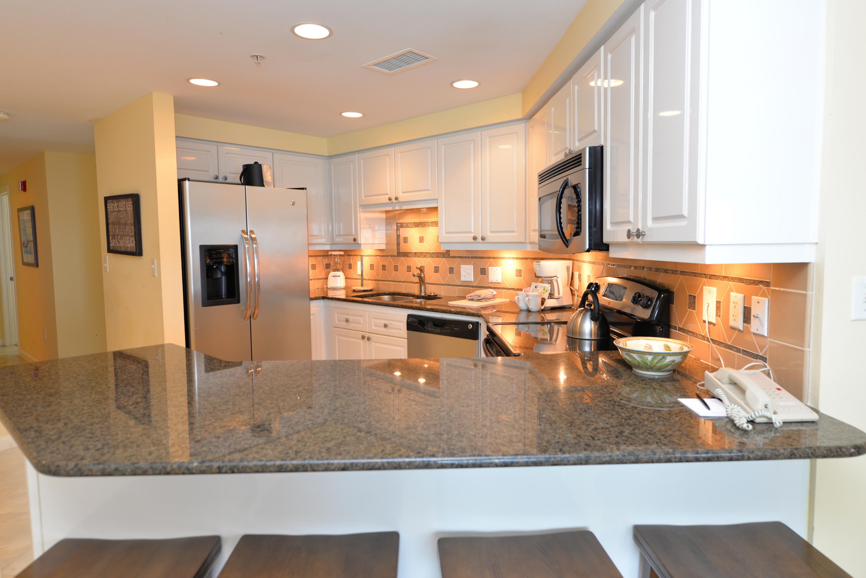 RELAXED ELEGANCE listen to the waves from the balcony of this seventh floor, updated three bedroom, three bath end-unit in the very desirable building of Westwinds. This very attractive condo features spectacular gulf-front views plus miles of coastline views. The kitchen features granite counter tops, stainless steel appliances, & white cabinets. The living & dining area opens to a wrap balcony providing even more living space for you & your guests to enjoy. Tile floors expand through the living area with carpet in the bedrooms. All three bedrooms have their own private bath. The master bedroom has two walls of windows overlooking the gorgeous gulf.
