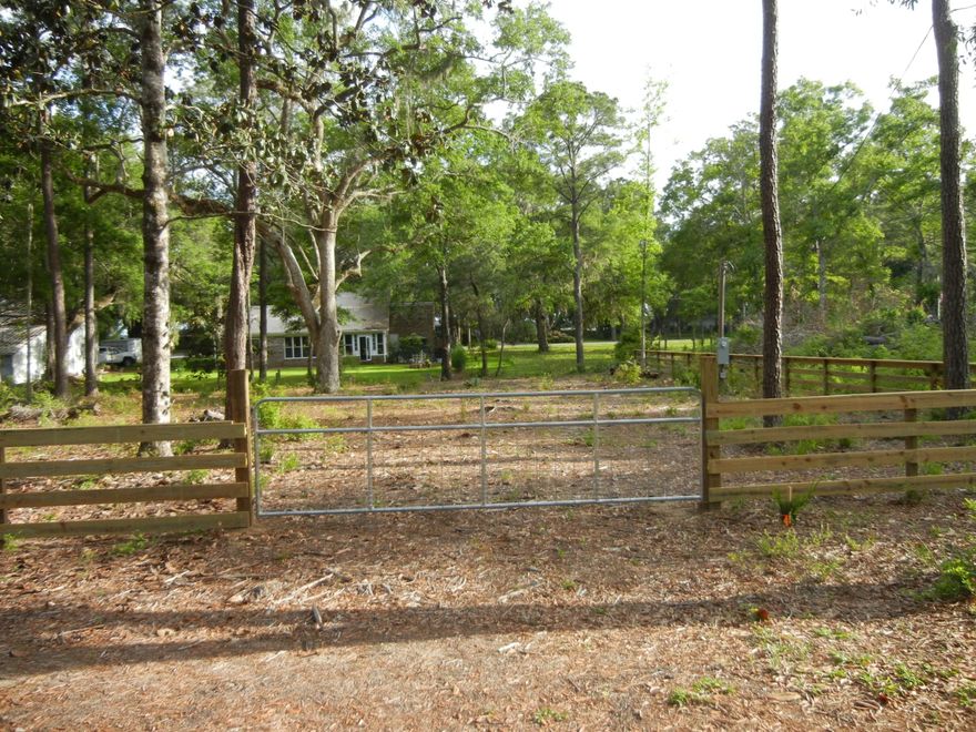 In a peaceful and quiet area, this lot has several mature hardwoods and pines, and 100' of canal frontage.Current owner has paid the water tap fee (over $2000), and water and electric service are already in place. (Sewer lines are on Wilson Way, but this lot is not yet hooked in.) A new fence and gate will give you security, and the lot is ready for the new owners to pull their R/V right in! No HOA fees, or restrictions.Several owners keep small boats docked along the canal. Buyer to determine all permitting required for the building of docks, or digging back in off the canal for larger dock installation.From this site, it is only 600 yds to Bear Creek, then another 225 yds into Jolly Bay (off of Choctawhatchee Bay, at the entrance to Black Creek and Mitchell River.)