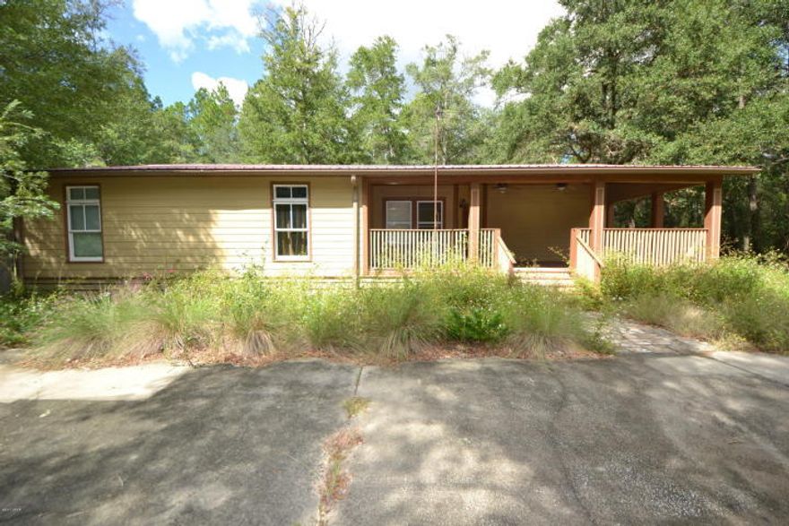 Love the Country, but enjoy the beach? This could be the perfect place. This 3 Bedroom 2 Bath home is Located in Ebro Florida, Just a short drive to Panama City Beach. The home features a large front covered porch, Open floor Plan, Large Kitchen with plenty of Cabinet and Counter Space and a huge Master Bedroom with walk in closet. The lot is 1 acre with plenty of shade. The home needs some work, however would make a great starter home, investment property or 2nd home. Schedule a visit today. All Ages, measurements and room sizes are approximate. Please verify if important.