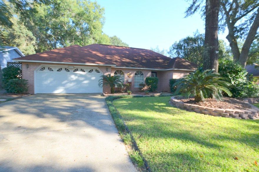 What a find! This popular neighborhood boasts minutes drive to interstate, hospitals, industrial parks, and of course UWF!. This gorgeous all brick home has privacy fenced back yard, yard building, wooden trails in back yard, and lush landscaping. Inside you will find split bedroom design; vaulted ceilings in living room with fireplace, large dining area as well as breakfast nook. Indoor laundry just off kitchen and master bedroom is large and inviting for this sized home and master bath is handicapped accessible with recently installed walk-in tub. Price these tubs out and you will that this is certainly an upgrade! Wall to wall carpets in living space and bedrooms and tile in wet areas. This home shows well from the street as well as inside and is a must see! Call Today!