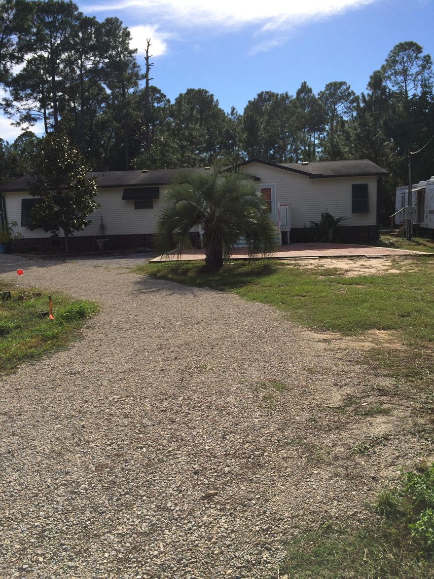 Need room to breath? Here it is. Spacious home with large lot in Santa Rosa Beach. Large open living room, dining room and kitchen. Fireplace with stone mantel. Master suite with large walk in closet. Masterbath has shower stall and soaker tub. RV hook up on property as well.