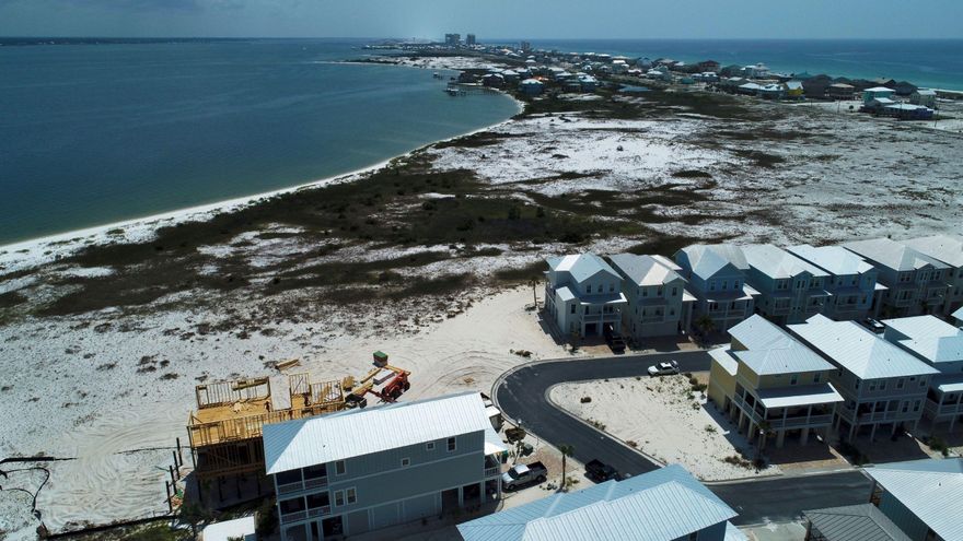 This prime homesite is situated in the charming Sound front neighborhood of 'By The Sea' in Navarre Beach. It is ideally located just one site back from the Sound and abuts the large Santa Rosa County Sound front Park which affords this site stunning, sweeping views of the Sound. The pristine gulf beach is just a short walk away! Amenities of this 65 site community includes a community pool with cozy fire pit and a walkway to the Sound.Navarre Beach is named Florida's 'Best Kept Secret' and is known for its Gulf Island National Seashore with miles of pristine, untouched beaches. With low HOA dues and NO build-out time, this site if perfect for your dream home. Buy today and reap the rewards of future appreciation.