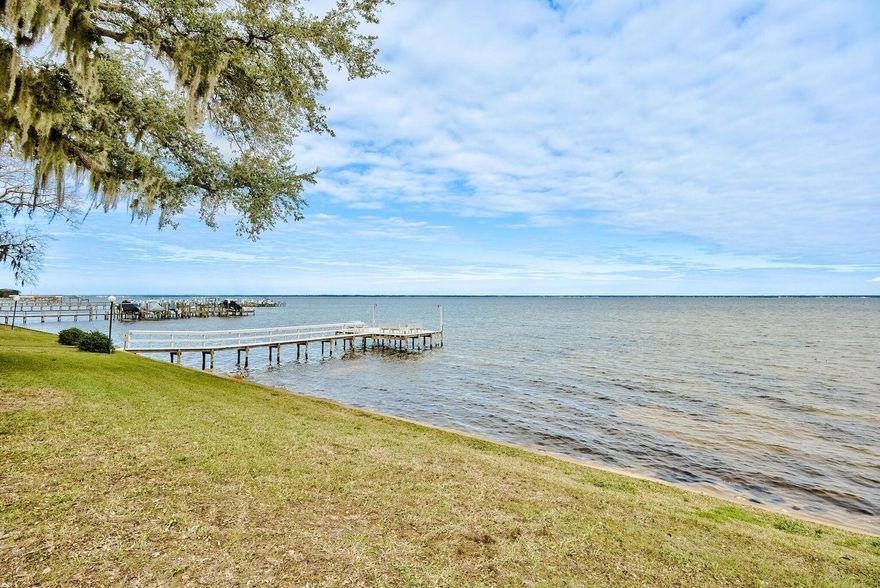 ''WATERFRONT UNIT'' This 3-bedroom, 2-Bath waterfront townhome in Destin offers stunning bay views and a perfect blend of coastal charm and modern comfort.  Nestled in a peaceful waterfront community, this multilevel home features a private balcony and patio to soak in the breathtaking sunsets over the bay.  Inside the open-concept living space is designed for both relaxation and entertaining.  The guest and primary baths have been renovated along with granite counter tops in the kitchen.  In 2021the following we put in new:  washer and dryer, new roof, hot water heater, new refrigerator, new floors and spray foam added to the attic to increase insolation.Also enjoy an Olympic size swimming pool, boat ramp and tennis courts!