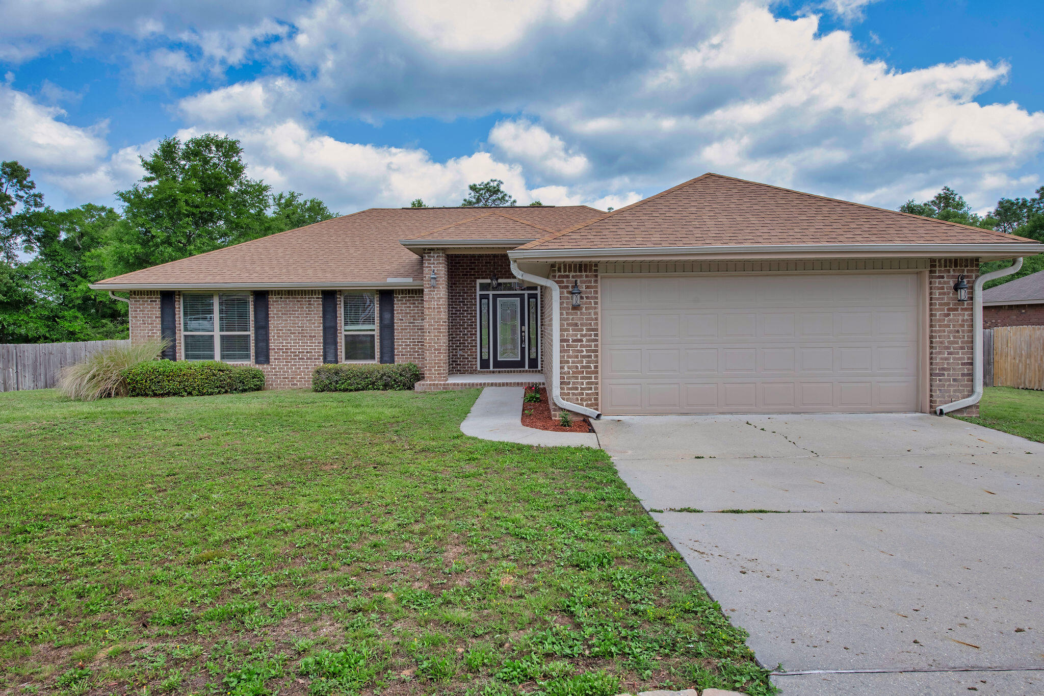 VA Assumable loan at 2.5%! Welcome to this beautifully updated home featuring 4 spacious bedrooms and 2 full bathrooms, perfectly located in Northwest Crestview. Step inside to discover fresh new paint and brand-new flooring throughout, creating a modern and inviting atmosphere. The vaulted ceilings with recessed lighting add an open, airy feel to the living spaces, ideal for relaxing or entertaining guests.The well-appointed kitchen offers ample storage and a functional layout that opens to the main living area. Enjoy plenty of natural light and seamless indoor-outdoor living with access to a large backyard--perfect for weekend BBQs, pets, or creating your dream garden. This home combines comfort, style, and space, all in a convenient location close to schools, shopping, and military bases.