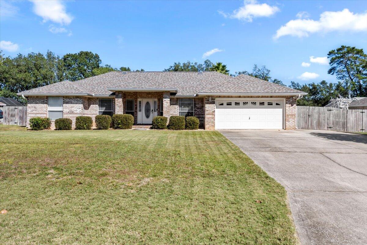 Nestled in sought-after Holley by the Sea, this stunning home is perfect for families and professionals alike. Minutes from pristine beaches and a short drive to Hurlburt Field, it captures the essence of Florida living. Situated on a spacious half-acre lot, the property features an extended driveway, a 30-amp RV hookup, a whole-house generator, and a large storage shed.  There are two 110-amp circuits for electric cars in the garage. Relax in the expansive screened Florida Room with soaring ceilings, ideal for hosting or unwinding.The backyard is an entertainer's dream, boasting a brick pizza oven, inground pool, and wait until you see the large (14' x 24') workshop-turned-man cave--perfect for football season! Inside, the home offers three bedrooms plus an office or flex space. The gourmet kitchen is a chef's delight, featuring custom soft-close cabinets, travertine countertops and backsplash, and high-end GE Monogram stainless steel appliances, including a refrigerator, gas range, wall oven, and microwave. The master suite boasts travertine flooring, two walk-in closets, and a luxury bath with a travertine-tiled shower, garden tub, and custom double vanity.

Two guest bedrooms have their own private area and share a bath. 

As a resident, you'll also enjoy access to a multi-million-dollar recreation center with pools, tennis courts, and more. This exceptional home offers the perfect blend of luxury and convenience, just minutes from white sandy beaches and a quick drive to Hurlburt Field and Pensacola.