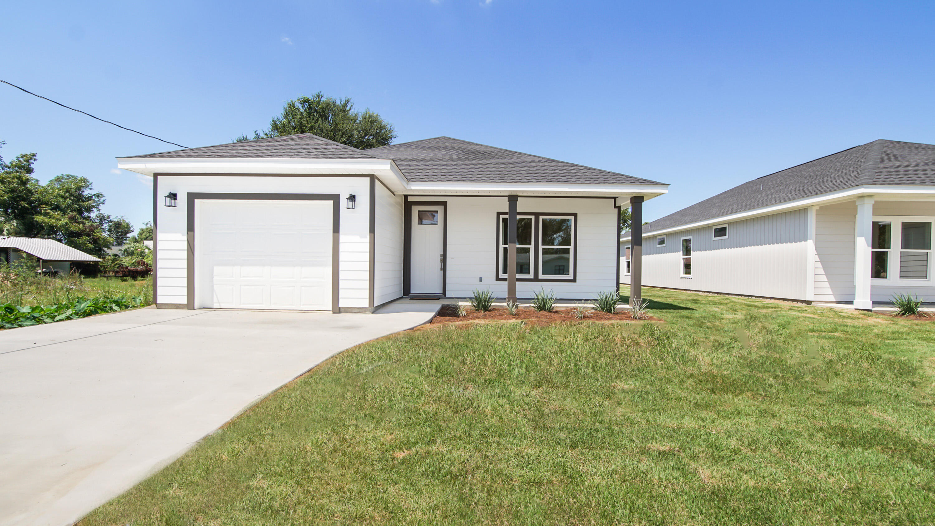 This charming new construction home is nestled in the picturesque neighborhood of Pretty Bayou. It boasts three bedrooms, two full bathrooms, and a half bath, along with a convenient one-car garage. The open floor plan features stainless steel appliances, LVP flooring and quartz countertops, creating a modern and inviting living space. This house would be an ideal primary residence. The central location offers easy access to both the beach and into town. Additionally, there is a public boat access just minutes away. Don't miss out on this special opportunity!
