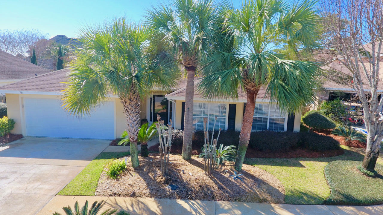 SELLER JUST REDUCED $20,000! Located along Scenic Gulf Drive, Avalon Beach Estates has a private beach access directly across the street from the neighborhood; The private gated beach access features over 500 ft area of gorgeous white beach sand! The community also features 2 tennis court, playground and a beautiful community pool. Key features of this home include hardwood floors, tile, fireplace, built in entertainment center in living room, and well maintained lush tropical landscaping throughout the pristine front and fenced back yard. Avalon Beach Estates is within close proximity of multiple shopping, restaurant, golf opportunities, and area attractions; with many amenities and key features to choose from, this great opportunity in an exclusive beachside community with low HOA fees won't last long
