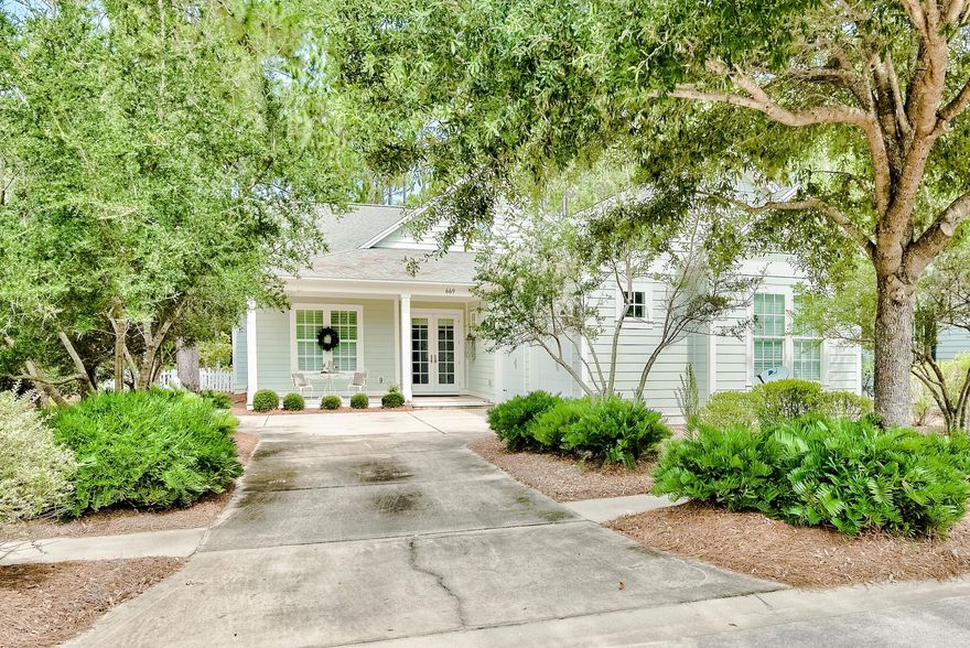 Nestled within the master planned community of WaterSound Origins, this stately residence resides on nearly a quarter acre homesite abutting to the tranquil preservation area. Constructed by the sought after team at Arthur Rutenberg Homes, the Sandpiper floor plan encompasses over 2,400 square feet of thoughtfully designed living space all on one single level. Upon approach, you are greeted by a deep front porch and two car garage. The foyer, adorned with wainscoting, leads to the spacious living area and Chef's kitchen featuring a luxury appliance suite, ample cabinetry, and curved island with bar seating. Synonymous with relaxation, the outdoor lanai overlooking the lush landscaping and fenced backyard is the perfect place to unwind and grill out on the custom outdoor kitchen. The main suite with abundant natural light and views of the backyard features a sitting area and grand ensuite with soaking tub, walk-in shower, double vanities, water closet, and walk-in closet. Two additional bedrooms and an office area currently configured as a fourth bedroom complete the living space. The utmost quality of craftsmanship can be found throughout to include soaring 10'+ ceilings, intricate trim work, and high-end finishes. 

WaterSound Origins offers residents a culmination of amenities while remaining geographically poised less than three miles from the white sugar sand and the world class dining and entertainment venues found along 30A. Notable amenities include a fitness center, seasonally heated pool, basketball court, pickleball court, tennis courts, a golf course, and numerous walking trails. Inquire today to schedule a viewing and discover why WaterSound Origins remains one of the Emerald Coast's most sought after coastal communities.