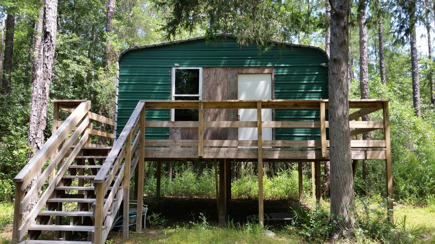 Enjoy the beautiful shoal river from this private retreat! Seclueded yet close to town this priperty would make a great weekend getaway. There is an elevated cabin and large shooting house on the property. The owners stated that there are many deer and wild hogs in the area for the hunters! Call today to schedule an appointment to view this unique waterfront acreage.