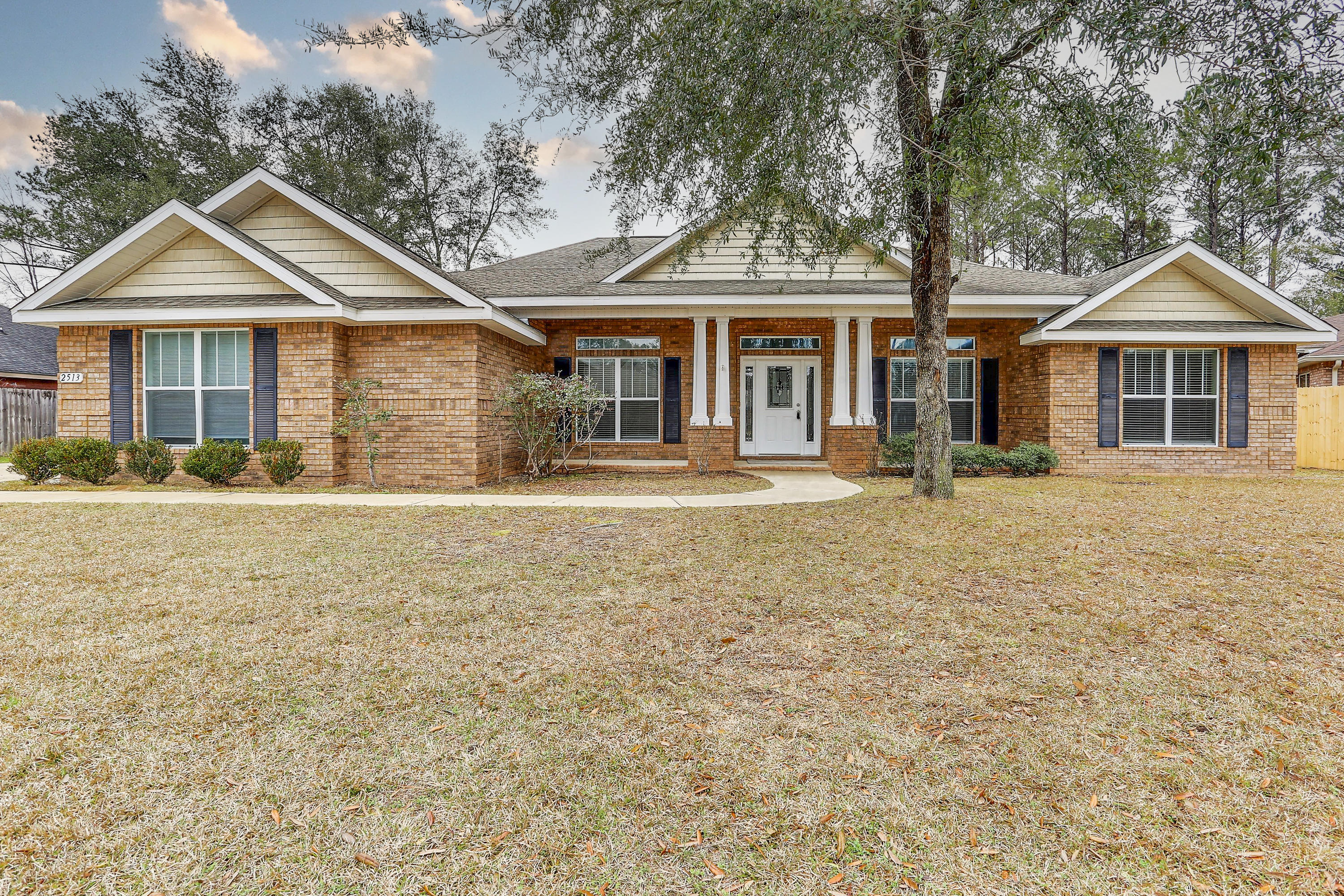 Come see this beautiful craftsman style 4 bedroom 3 full bath with a 3 car garage located in the sought after subdivision of Wind Meadows with convenient access to schools and shopping in North Crestview. The home has been freshly painted in Agreeable Gray, with new LVP flooring throughout the main living areas, and new carpet in the bedrooms. The home features include an office and formal dining room, open concept kitchen/family room, split bedroom design with 2 bedrooms sharing a jack-n-jill style bathroom, and large covered and screened in back porch. The kitchen features Jenn Air downdraft electric cooktop located on a oversized kitchen island, stacked cabinetry, granite countertops, in wall double oven perfect for entertaining. The master suite features an oversized walk in shower,