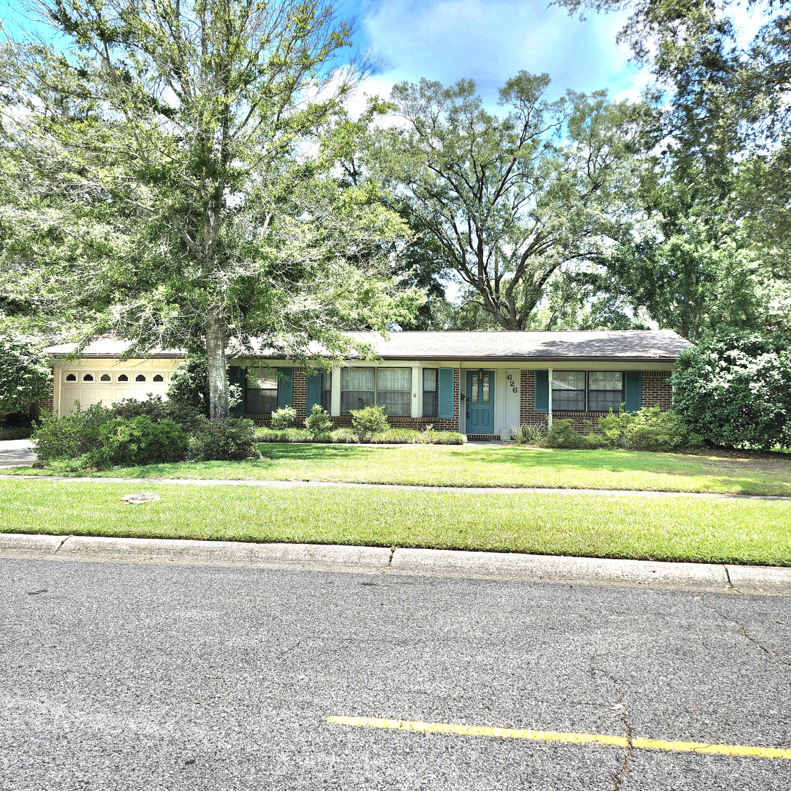 Great potential on this mostly brick home in the desirable subdivision of Kenwood. This home offers 5 bedrooms with 2 master suites and 3 full baths. Pretty parquet floors in 4 of the bedrooms. The formal living area features a bay window and opens to the formal dining area. The kitchen has a breakfast bar plus an eat-in area with a bay window and built-in bench. The den opens to the kitchen and has nice built-in shelves and cabinets for extra storage. The additional master bedroom and bath were added in the mid 1980's. It's secluded from the other bedrooms for maximum privacy. The backyard is beautiful with lush landscaping and the blueberries are almost ready to pick. The HVAC was installed in 2018, the hot water heater in 2023 and the roof in 2007. View this home today.