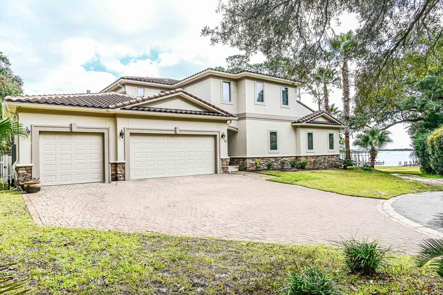 A rare opportunity to own a premier Sound-front residence in one of Mary Esther's most private and desirable locations.Perfectly positioned at the end of a quiet cul-de-sac just east of Mary Esther Blvd, this deep-water property offers exceptional luxury living with panoramic views of the Santa Rosa Sound and the Gulf. The main level showcases 10' ceilings, a guest suite with full bath, and expansive living, dining, and kitchen spaces designed to maximize natural light and water views. Upstairs, 9' ceilings, a spacious master retreat, and a convenient laundry room create an ideal layout for comfort and privacy. Every bedroom features its own private full bath and direct views of the Sound, with two oversized balcony doors leading to a serene outdoor sitting area--perfect for sunrise coffee or sunset relaxation.

Situated on over half an acre, the home sits elevated and set back from rising waters, offering both peace of mind and stunning vantage points. The large veranda overlooking the backyard is ideal for entertaining, complete with an outdoor gas fireplace for cozy evenings. The luxurious Master Suite includes a wet bar, gas fireplace, and breathtaking dual views of the Sound and Gulf, along with an expansive 11' ?? 12' walk-in closet. The kitchen boasts a massive center island designed for gathering, entertaining, and everyday enjoyment, while a large room just off the kitchen providing additional flexible living space to use as YOU desire.

Additional features include a heated and cooled workshop with a sink inside the garage... just the place for hobbies or projects. From the private dock, enjoy fishing, sunning, boating, or watching spectacular fireworks displays from Fort Walton Beach, Hurlburt Field, and Navarre.

This remarkable home is a true slice of paradise on the Emerald Coast and an exceptional chance to own unmatched Sound-front luxury in Mary Esther.
