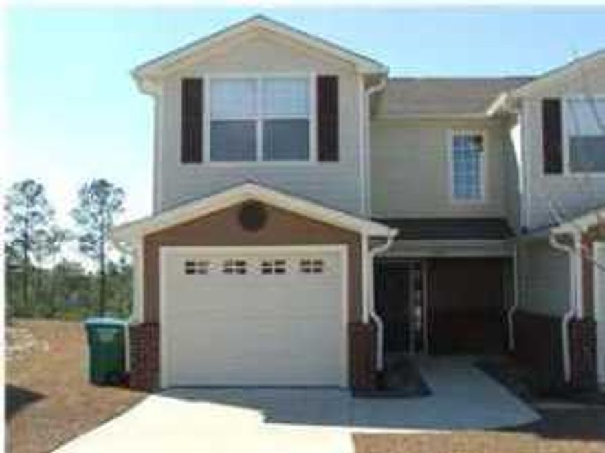 This well kept developed town home community consist of a nature preservation area with nature trails, a gazebo and overlook pavillion. Cool down after a long day at work by the community pool with changing rooms. This location south of I-10 makes for a very convenient drive to area beaches and military bases. This is a two story traditional design with brick and Hardy plank exterior. The floor plan has the living, kitchen, and half bath downstairs, and bedrooms with baths upstairs.