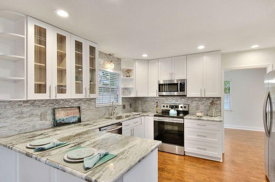 100% Move In Ready-*Appraisal In Documents 362,000 from Certified Va appraiser*One of a kind Destin gem that has been professionally remodeled! Master Bath one of a kind** Home has been completely re-wired with new copper wiring. New upscale kitchen, high end quartz, glass backsplash, stainless steel appliances, can lighting, new flat ceilings throughout, new baths, master bath has new custom shower and walk in closet, hall bath has custom tile surround with custom niches, new light fixtures, ceiling fans, custom flooring, and outside brick has been custom painted to modernize home. Inside custom utility room includes washer and dryer cabinets, Garage Drywalled-. Restaurants, shopping, Destin Middle School, and the beautiful white sandy beaches of Destin are just minutes aw