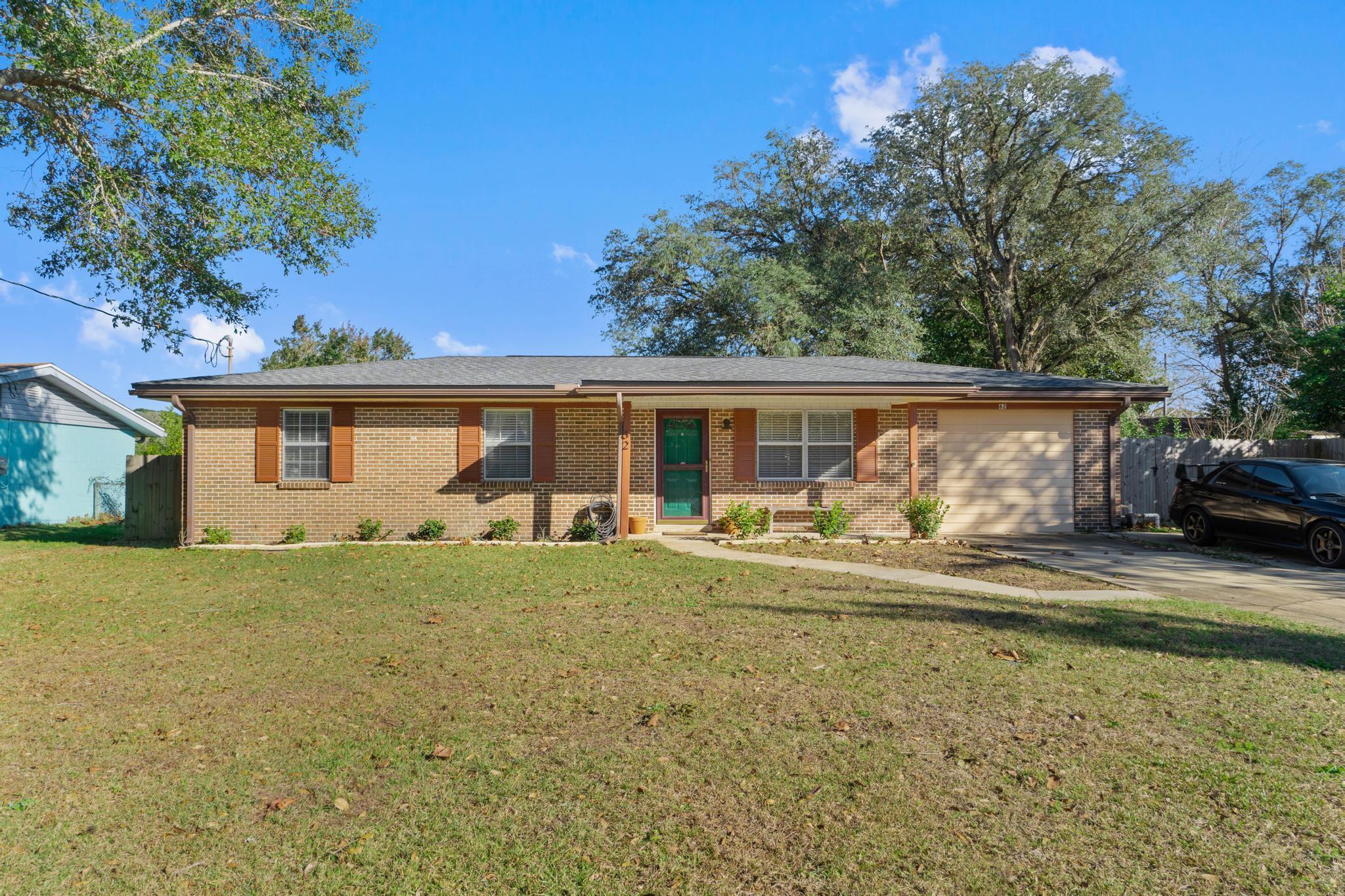 Beautiful updated brick home located close to Eglin and Hurlburt. This move in ready home has 4 bedrooms, 2.5 baths, and NEW ROOF(2021). Updates include new HVAC (2018), hot water heater (2018), re-wire, oversized driveway, new blinds, and paint. The updated kitchen has white shaker cabinets, granite countertops, stainless steel appliances, built in butcher block, and subway tile backsplash.The split floorpan has a master suite with walk in closet and bathroom with walk in shower and double vanity with granite countertops. This family friendly home has 3 additional bedrooms and two additional bathrooms (1 full, 1 half). The beautiful backyard is fully fenced and includes a sprinkler system. Additional features include large laundry room with washer/dryer, covered front porch, and laminate flooring in main living areas.