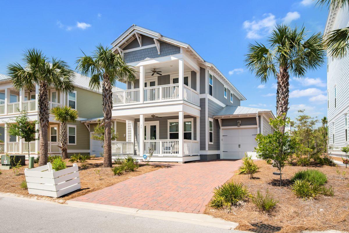 An elegant coastal retreat with modern finishes located south of 30A in the community of Prominence. Ideal for full-time living or a rental investment, this beach home is fully-furnished and move-in ready. Open and spacious, natural light flows through this home with its many windows, tall ceilings, and 8-foot doors. Prepare meals in an expansive gourmet kitchen with a large breakfast bar, stainless steel appliances, and quartz countertops. This four bedroom home offers the owner's suites on the first level with three guest rooms upstairs. Two guest bedrooms on the second level share a covered porch. Additional outdoor entertaining spaces can be found on the first level with its porch and a deck with plenty of room for grilling, dining, and sunbathing.