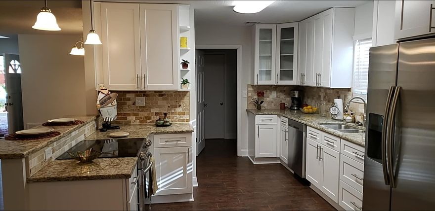 **Square Feet includes brand new florida room-Permitted Location is in desirable Bluewater Bay community! Inside the home you have a great floorplan. The grand living room features a vaulted ceiling and a cozy gas-fireplace, a fourth bedroom and a full bathroom upstairs, Home remodeled 2019 with New Roof, Ac, new interior paint, new hardwood laminate floors, lighting fixtures, new kitchen and baths from granite counter tops to stainless steel appliances. Additional living space includes a Florida Room. Enjoy a quick trip to Destin only minutes from Mid-Bay Bridge so you have easy access to the beautiful beaches of Destin. Restaurants, shopping, and schools are just a short commute away as well. Move in and start living the good life. Check documents for a full list of improvements.