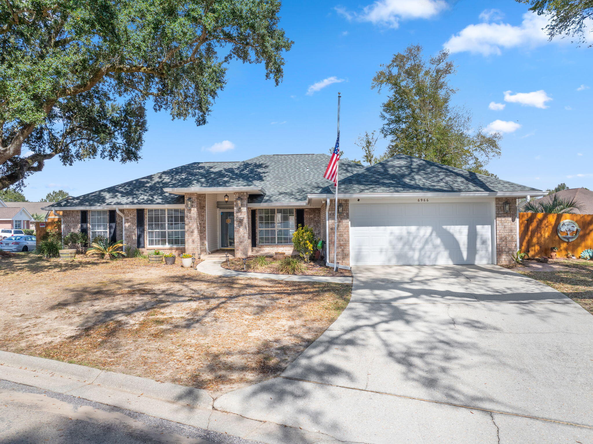 Welcome to this meticulously maintained home - nestled among the BEAUTIFUL and mature Heritage Oak Trees in the Sundial Estates neighborhood in Milton, FL. Located minutes from the beach, airport, and Pensacola points of interest. Recently upgraded with a newer roof, new privacy fence, fresh interior paint, new Smart Garage opener, and a whole house PEX plumbing system for ultra efficiency and peace of mind in the cold winter months. Also armed with Hurricane protection by Rebuild N.W. Florida including shutters and garage door, as well as an ADT security system with exterior security cameras. Featuring a split floor plan, you enter through the thoughtfully designed foyer with classic french doors to the office space on your left, and the formal dining space - framed by GORGEOUS rounded archways - to the right. Straight into the open concept living space that seamlessly blends into the kitchen with upgraded stainless steel appliances & quartz countertops and a breakfast nook that has a view of the screened in lanai. Down the hall past the kitchen is the primary suite with THE MOST AMAZING ensuite - Boasting 2 walk-in closets, walk-in tiled shower, linen closet, and double vanity. Side exterior door out of the primary bedroom that leads to the STUNNING salt water pool. The laundry room includes a 3 year old Maytag washer and dryer that convey with the sale of the home. The opposite side of the home holds the 3 additional bedrooms and full bathroom. The fenced in backyard also houses a fantastic shed/workshop for additional storage, hobbyists, or a man-cave/she shed! Schedule your showing today!