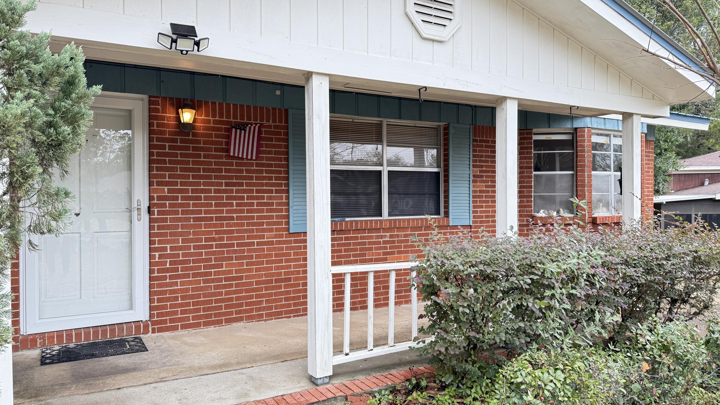 Perfectly located 3-bedroom, 2-bath home with 1,362 sq. ft., ready for your personal touch! Perfect for VA or FHA Renovation loans, or conventional financing. Metal roof 2008, brick front facade with T-111 wood siding on three sides, covered front porch, open back deck, yard building, eat-in kitchen with tile flooring, a cozy living room with wood flooring, hall bath with a tub-shower combo, master bath walk-in shower, bonus room adds flexibility,  hot water heater(2005) is in laundry room, home may have aluminum wiring. Some wood rot requires attention, making this an ideal opportunity for investors or buyers ready to add their personal touch. Don't miss the potential--schedule your showing today! Home is being sold AS-IS