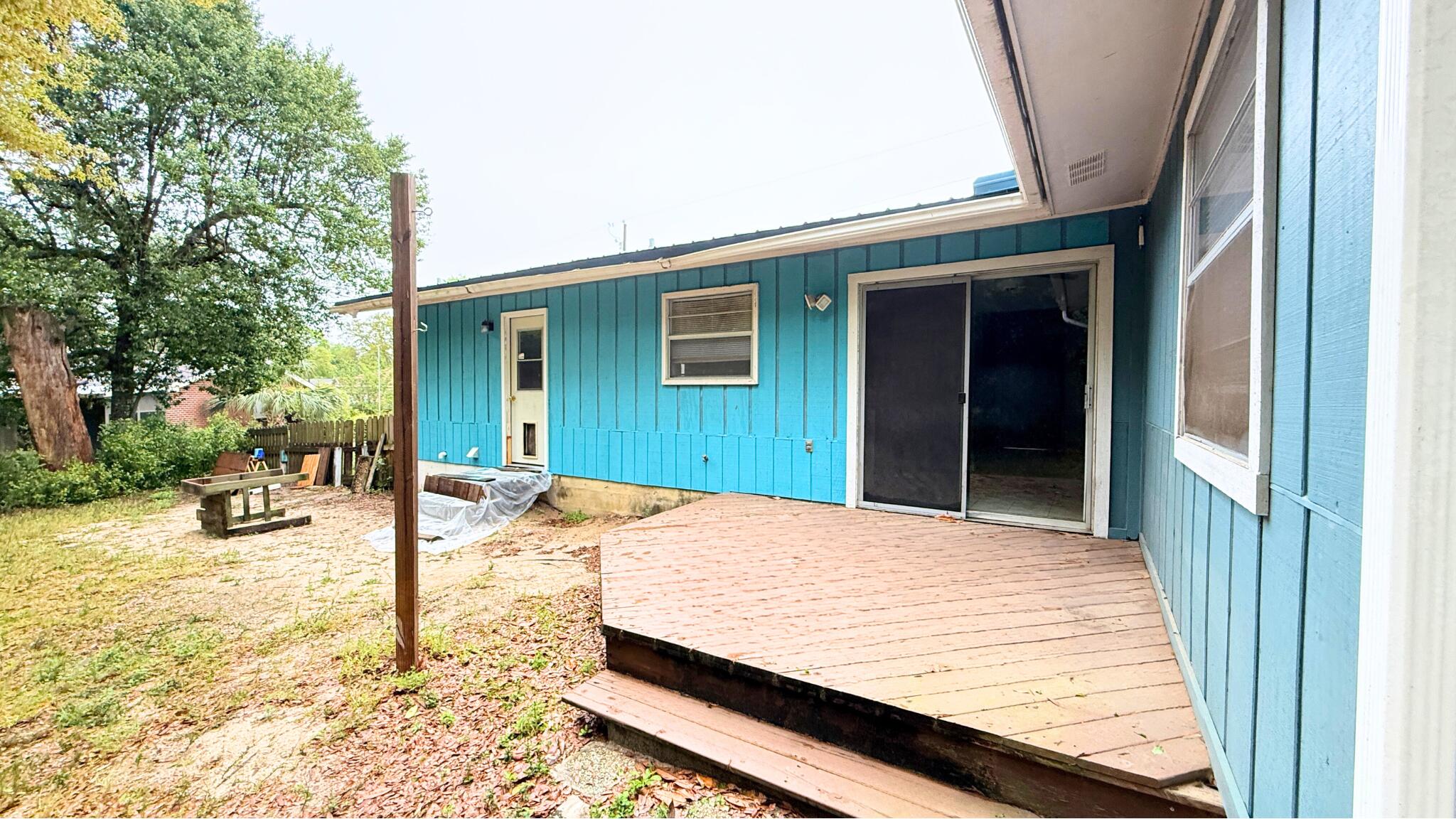 Perfectly located, this charming 3-bedroom, 2-bath home offers 1,362 sq. ft. of opportunity! Property is ready for your personal touch. Featuring a metal roof (2008), Hot water heater (2005) a brick front facade with freshly repaired/painted T-111 wood siding, covered front porch perfect for relaxing. The open back deck and yard building offer additional space for outdoor enjoyment. Inside, you'll find a cozy living room, eat-in kitchen, and a bonus room/Flex space. The hall bathroom includes a tub-shower combo, while the primary bedroom features a barn door and a walk-in shower. This home is priced to reflect its potential. Seller offering a $500 Home Warranty Don't miss this chance to create your dream space--schedule your showing Today!