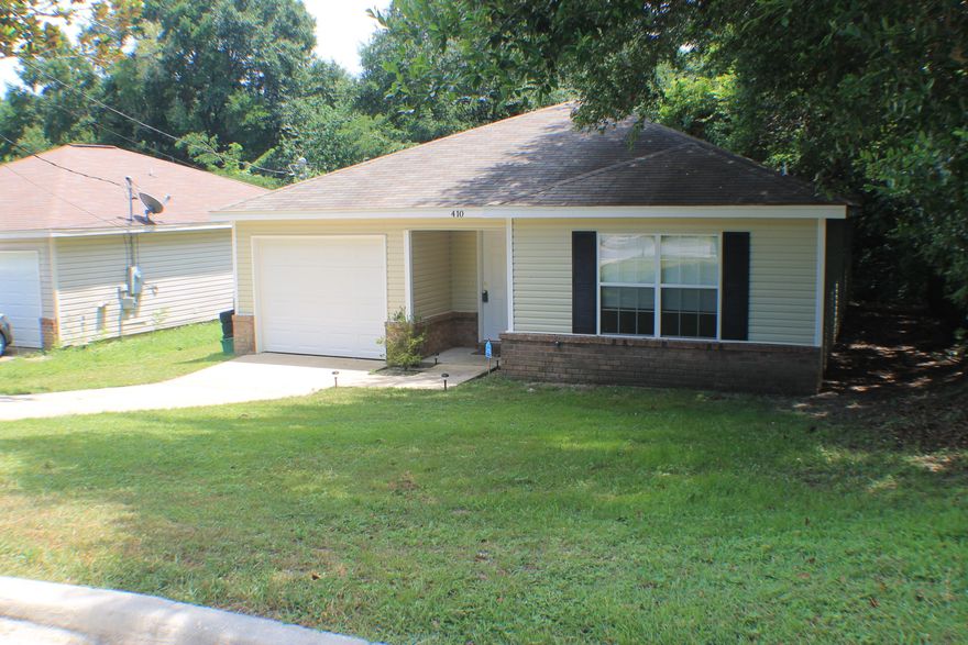 Cute 3 bedroom 2 path house with spanish lace ceilings (no pop-corn to clean up),custom cabinets,smooth top stove,microwave range hood, pantry, and a garage door opener. Convenient to town! This home features Tile floors,a cathedral ceiling, garden tub, huge walk in closet and a Large lot 180 Feet deep!!Double french doors take you to the back yard where there is plenty of room for a pool or a ball game!