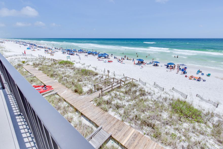 BACK ON THE MARKET! BUILDERS & INVESTORS LOOK! This GULF FRONT townhome is ready for you to buy today to flip tomorrow! It's all about the views three decks overlooking the gulf. One each from ground floor, first floor, & second floor you are literally on the beach. From the street you are viewing two stories & from the beach it's three stories. The main townhome encompasses the living area, dining room, kitchen, & a half bath while upstairs there are two bedrooms & two baths. The master bedroom has access to one of the three balconies overlooking the white sand beach & the beautiful emerald waters. On the beach level there is approximately 400 square feet of buildable space with a separate entrance  plenty of room for a living area, bedroom, bath, & efficiency kitchen. You can use it