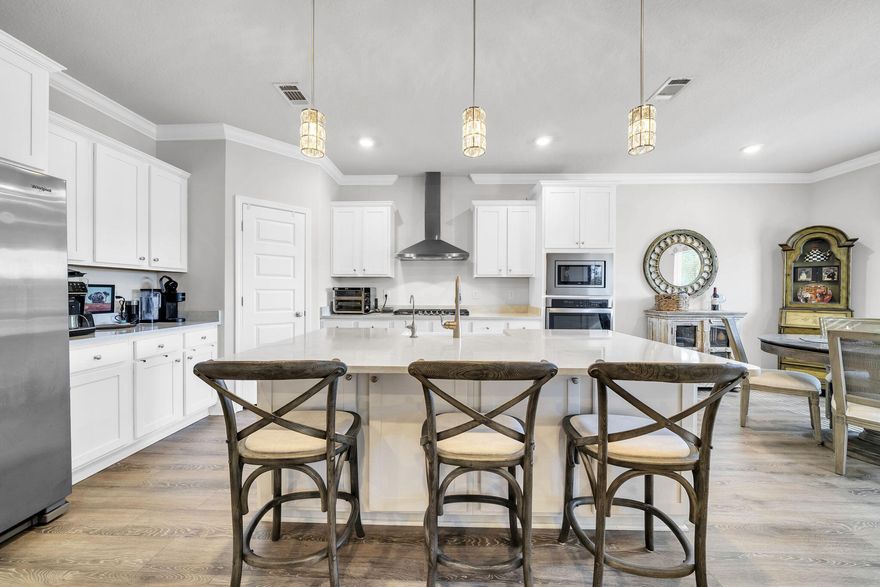 You pull into Lakeview Estates, the gate closing softly behind you, the noise of the day just . . .fades.  This is Santa Rosa Beach living the way many people hope to find it - close to everything yet comfortably tucked away.  This five-bedroom home is designed for real life.  Mornings start easily in the open kitchen, where quartz countertops, generous cabinetry, and plenty of workspace make everything from quick breakfasts to weekend gatherings feel effortless.  The kitchen flows naturally into the main living area, so conversations carry, laughter lingers, and no one feels tucked away while hosting.   The split floor plan is a quiet win.  The primary suite offers a true retreat at the end of the day, while the additional bedrooms flex to fit your life - guest rooms, home offices, hobby space, or a little of everything.  Step out to the screened porch and enjoy evenings outside without the bugs, a simple pleasure that never gets old.  The oversized garage adds breathing room for storage, beach gear, bikes, or weekend projects.  And then there's the location.  A short drive puts you at the baches, dining, and shopping along 30A, with easy access to Highway 98 when life calls you elsewhere.  Back home, the community pool and well-kept surroundings remind you why gated neighborhoods are so appealing - quiet streets, familiar faces, and a sense of ease.  With no short-term rentals allowed, Lakeview Estates is intentionally calm, making this home a great fit for a primary residence or a second home for those who want a low-traffic coastal lifestyle - close to the action, but never caught in it.