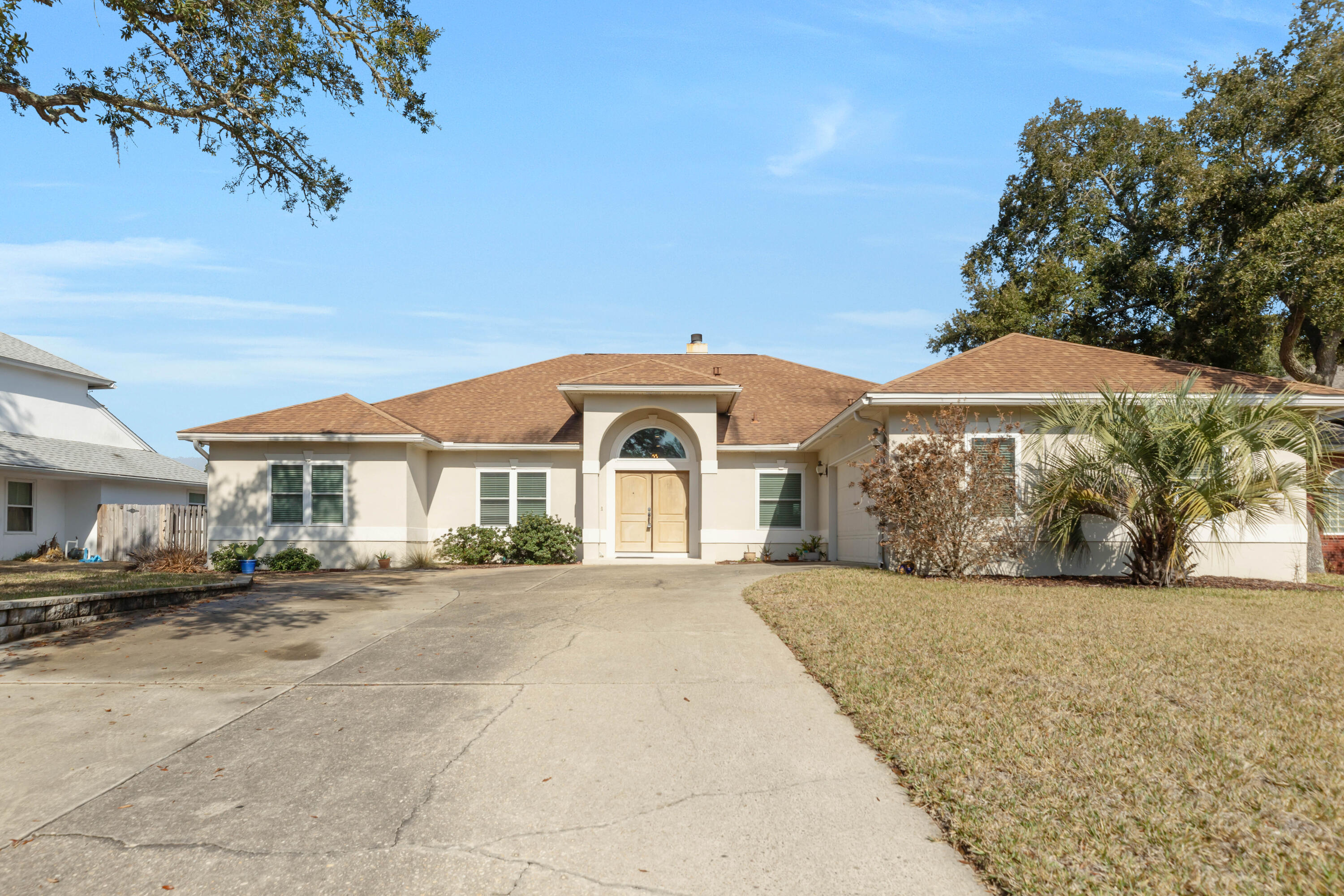 Custom-built home, situated on one of the largest lots in the Lake Pointe Subdivision, offers 4 bedrooms and 3.5 bathrooms within 3,237 square feet of living space. The residence features a spacious covered lanai and a 24x42-foot salt water low maintenance pool, perfect for entertaining. The expansive backyard provides ample space for recreation and relaxation. You'll find soaring 10-foot ceilings throughout and 12-foot in other areas, a welcoming living room with built-ins and a fireplace, and an open kitchen with a breakfast bar and island. The master suite is a true retreat with its own office and spa-like bath. With generously sized bedrooms and a Jack & Jill bath, this exceptional home offers both comfort and style!