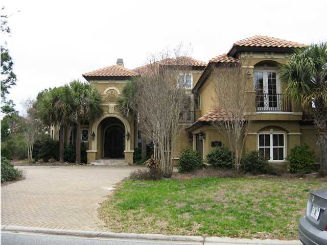 Enjoy living in this upscale community in an elegant house located on the 13th tee. Lake views. Entry area has 21' ceilings. Kitchen opens into dining area and sitting room. Separate wine room. Master bedroom and large master bath located on the first floor. Beautiful handrails and wrought iron staircase leading to the second floor. Nice second floor balcony area. Home theatre room with sound proof walls. Summer kitchen with stainless grill, sink and refrigerator located next to pool area. All room dimensions are approximate. REO foreclosure.
