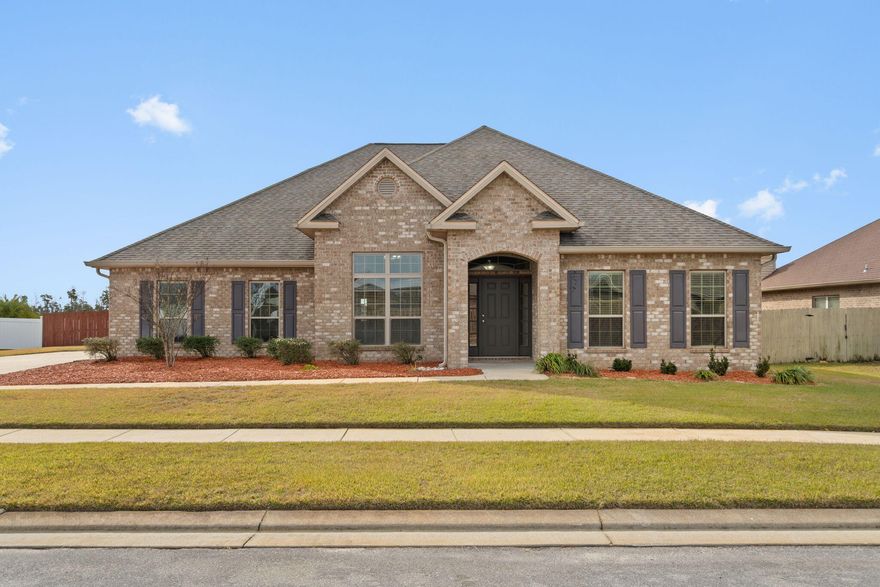 Start your New Year in this beautiful like new home! It has all the space you need with over 3,000 square feet of ONE level living space.  That's right, this brick beauty offers 5 bedrooms, 3 full bathrooms, a dining room, and a separate office all in a one story home. Step inside to appreciate the inviting open split floorplan with exceptional finishes, neutral color pallet, tile flooring, and fresh new carpet throughout. As you enter through the large front covered porch, you'll discover a flexible space that can serve as a dining area, a home office, or more, the possibilities are endless. A whole second area in addition to the formal dining area is versatile as well with French doors to create a private home office, home theater, playroom, fitness room, you name it. At the rear of the home the private primary suite has access to the back yard, it includes a spacious walk in closet and a bathroom with a large soaking tub, beautifully tiled shower and double vanity. Check out the floorplan to see how the four additional bedrooms are privately located off the main living area and hall.  
This home was designed with families and entertaining in mind. You will love preparing meals in the gourmet kitchen with designer cabinets, granite countertops, a breakfast bar, and a large island.  The kitchen is a true standout, there is cabinet storage for every gadget you can imagine, counter space galore, and an enormous walk in pantry. While in the kitchen you can have a full view of the living room, kitchen nook, and views out back to the covered porch.  

The entertaining space continues out back to a spacious covered porch and a large fenced in backyard. The backyard is your canvas for your own oasis where there is room for a pool and much more. This location offers the convenience of no HOA, nearby shopping, and a swift commute to Tyndall Air Force Base, Gulf Coast Medical Center, community schools, and surrounding cities. Schedule your viewing today.
