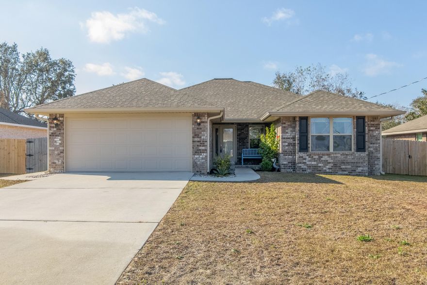 Are you looking for a great buy in the perfect location?  You found it!!! Located in the heart of Gulf Breeze, this all brick home, only 3 yrs new, features a great layout with 4 bedrooms, front covered porch, rear lanai, spacious living room and Nafco flooring throughout excluding bedrooms. Relax in your master retreat w/ trey ceiling, sitting area, large walk in closet and a 5' walk in shower, corner garden tub and a double vanity in the bath. The kitchen offers white cabinetry, granite countertops, a breakfast bar & stainless appliances. Enjoy the outdoor space with a fully fenced back yard, covered lanai and comes equipped with a lawn pump and sprinkler system. From the inside/out, you'll truly enjoy the coziness this home has to offer.